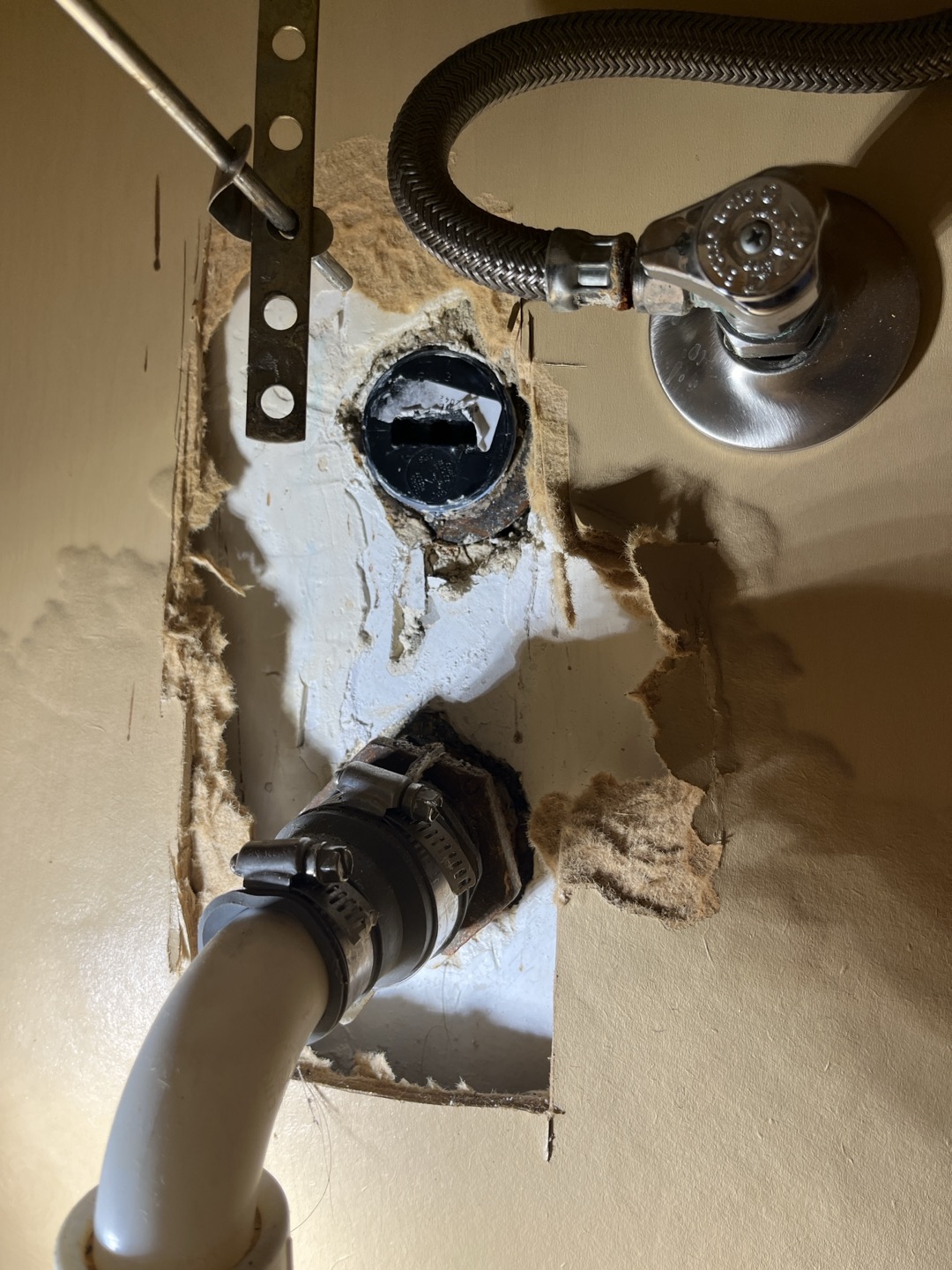 Existing cleanout plug for bathroom sink was damaged and leaking. Removed plug and added new abs plug 