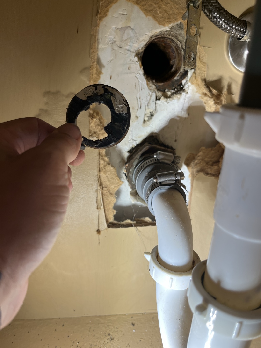 Existing cleanout plug for bathroom sink was damaged and leaking. Removed plug and added new abs plug 