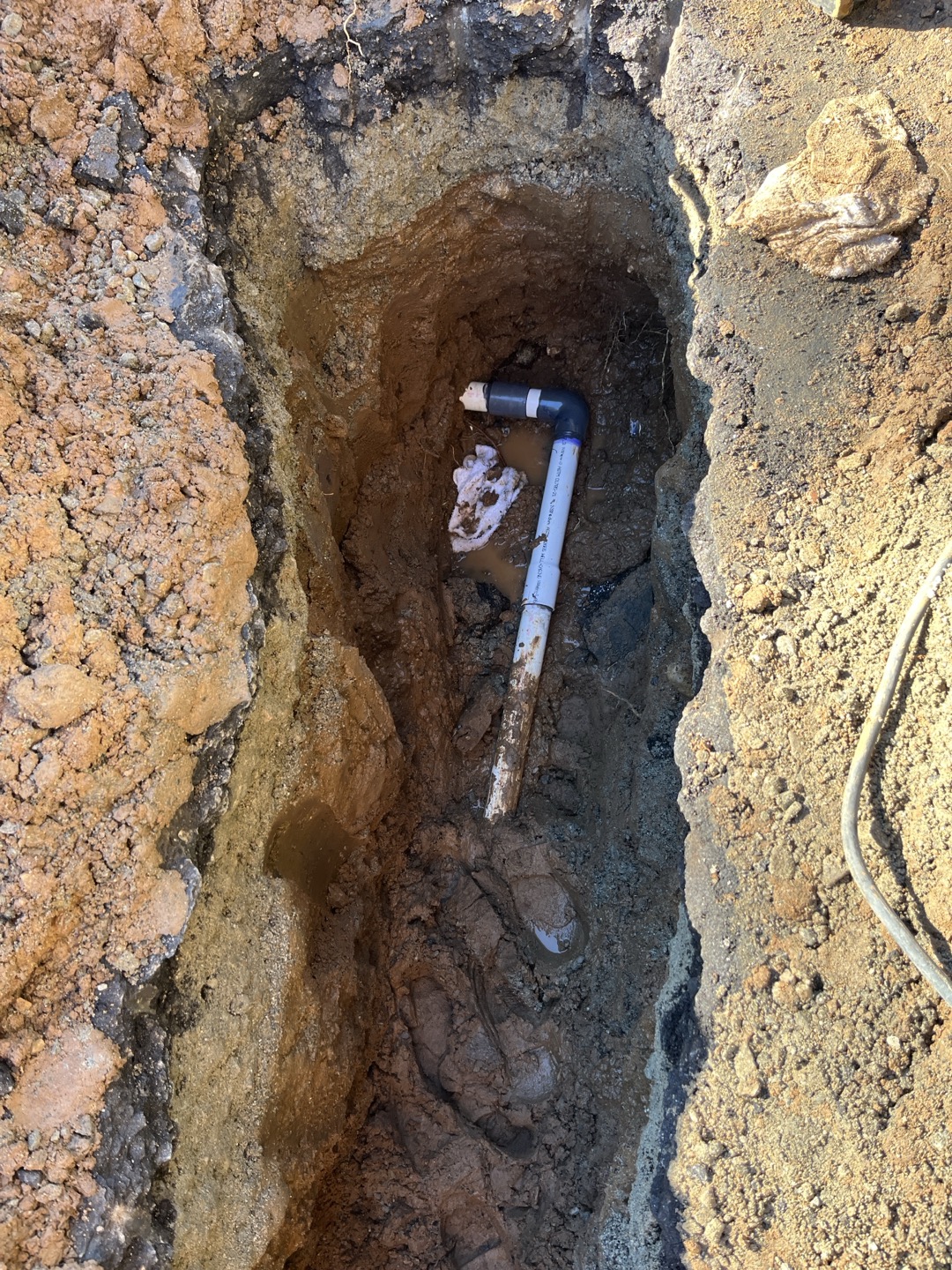 Customer had a leaking water service located in front of building. In order to perform repair we will need to saw cut and jackhammer concrete to access pipe. 


Found customer had a broken 2” 45. Removed damaged section and plu,bed in new section with schedule 80 pvc fittings 