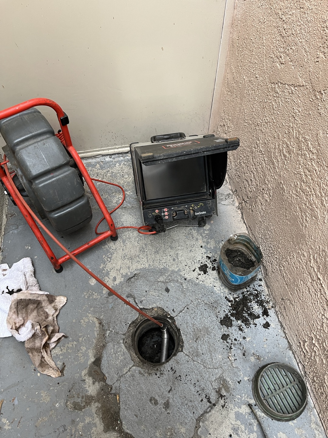 Customers area drain located at bottom of stair case had large amounts of debris and dirt inside of catch basin. Removed debris and dirt and attempted to perform camera inspection. Camera only entered approximately 1’ before hitting what appeared to be concrete or some kind of cap. This leads me to believe this drain is not in service and serves no function. Inspected both entrances leading downstairs and saw that all entry ways leading to stairs were graded away from stairs which directs water away from entering stair case. If tenants have issues with water draining down stairs and entering the units the only way to direct water away from units was be to install a catch basin with a pump that pumps water out of stair case area and terminates away from stairs. 