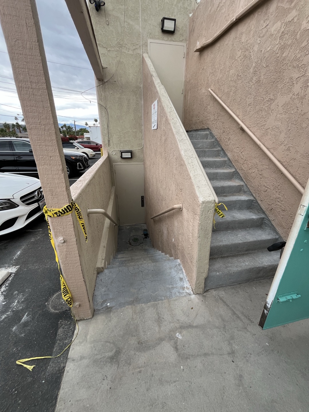 Customers area drain located at bottom of stair case had large amounts of debris and dirt inside of catch basin. Removed debris and dirt and attempted to perform camera inspection. Camera only entered approximately 1’ before hitting what appeared to be concrete or some kind of cap. This leads me to believe this drain is not in service and serves no function. Inspected both entrances leading downstairs and saw that all entry ways leading to stairs were graded away from stairs which directs water away from entering stair case. If tenants have issues with water draining down stairs and entering the units the only way to direct water away from units was be to install a catch basin with a pump that pumps water out of stair case area and terminates away from stairs. 