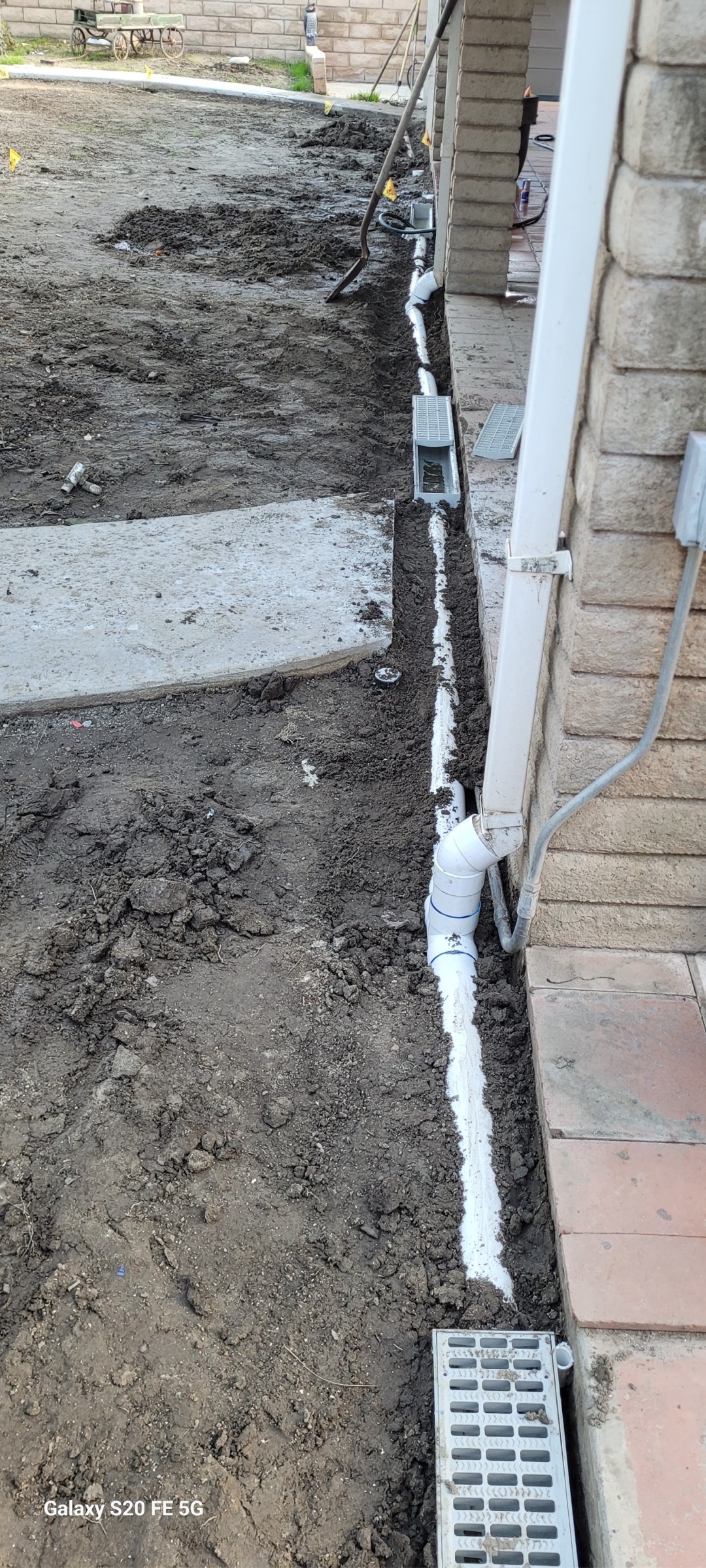 Hydrojetted area drain and removed large amounts of dirt and rocks. Performed inspection and found that several of the drains located in the backyard were either broken or backgraded leading to issues of flooding when a heavy rain occurs. Recommend digging up and replacing approximately 50’ of area drains in backyard. Also recommend diverting rain gutters directly into its own drain and adding another 4 drains in backyard to catch run off from backyard. 