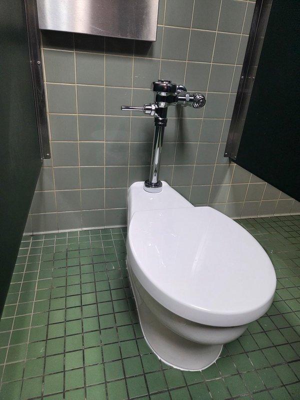Conducted inspection of public restroom facilities including examination of three automatic faucet sinks with marble-patterned countertop and wall-mounted urinal system. All plumbing fixtures were verified to be in proper working condition with no visible leaks or functional issues. Confirmed proper operation of flush mechanisms and water supply systems throughout the facility.