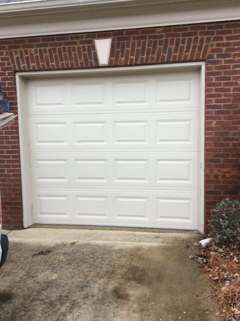 Installing 8x7 traditional short panel raised garage door. 