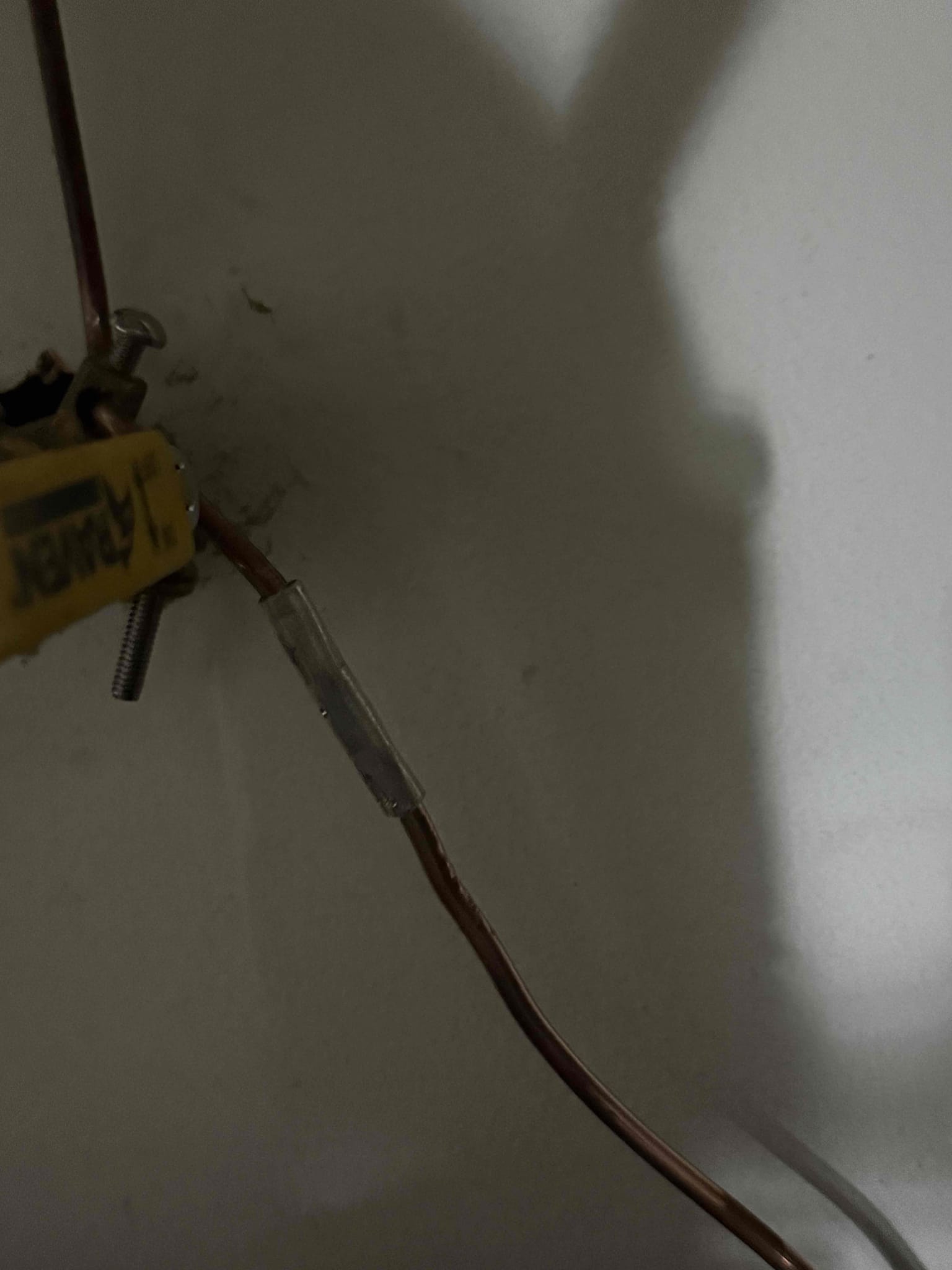 Met inspector onsite and he requested that we extend the water heater bond to include the gas line. Installed a permanent crimp on the wire and ran a new piece of wire down the the gas line with a clamp. Emailed photos to inspector to finalize the inspection.