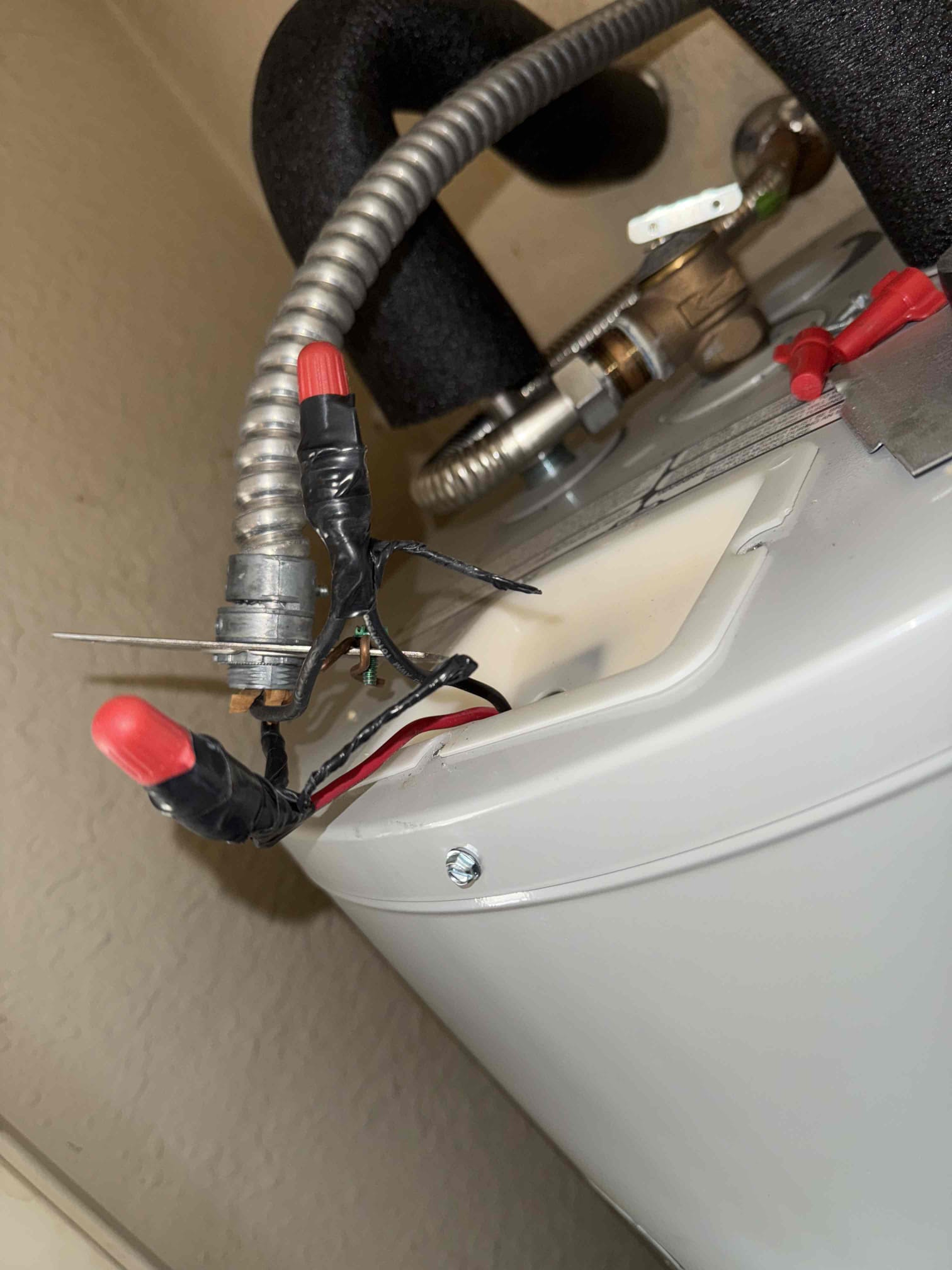 Troubleshooting water heater breaker tripping and checking water heater connections. Found that the whip going to water heater didn’t have connector and also the white wire has cuts in insulation. Installed connector and cleaned up wire inside water heater and disconnected and reset breaker and had 240v hot to hot and 120v hot to ground. When reconnected after repairing, it still was tripping which means that it is an issue with water heater. There are no issues with the electrical feeding water heater as of right now. 