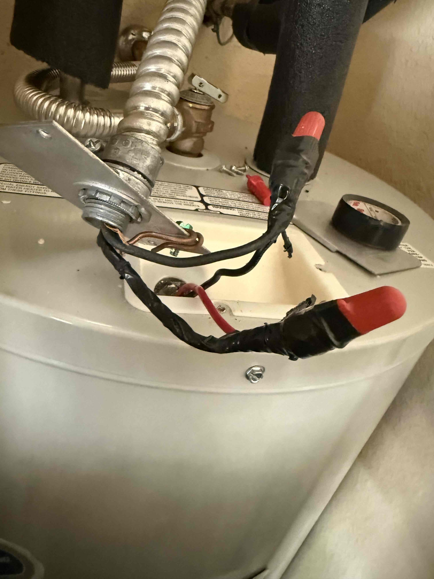 Troubleshooting water heater breaker tripping and checking water heater connections. Found that the whip going to water heater didn’t have connector and also the white wire has cuts in insulation. Installed connector and cleaned up wire inside water heater and disconnected and reset breaker and had 240v hot to hot and 120v hot to ground. When reconnected after repairing, it still was tripping which means that it is an issue with water heater. There are no issues with the electrical feeding water heater as of right now. 