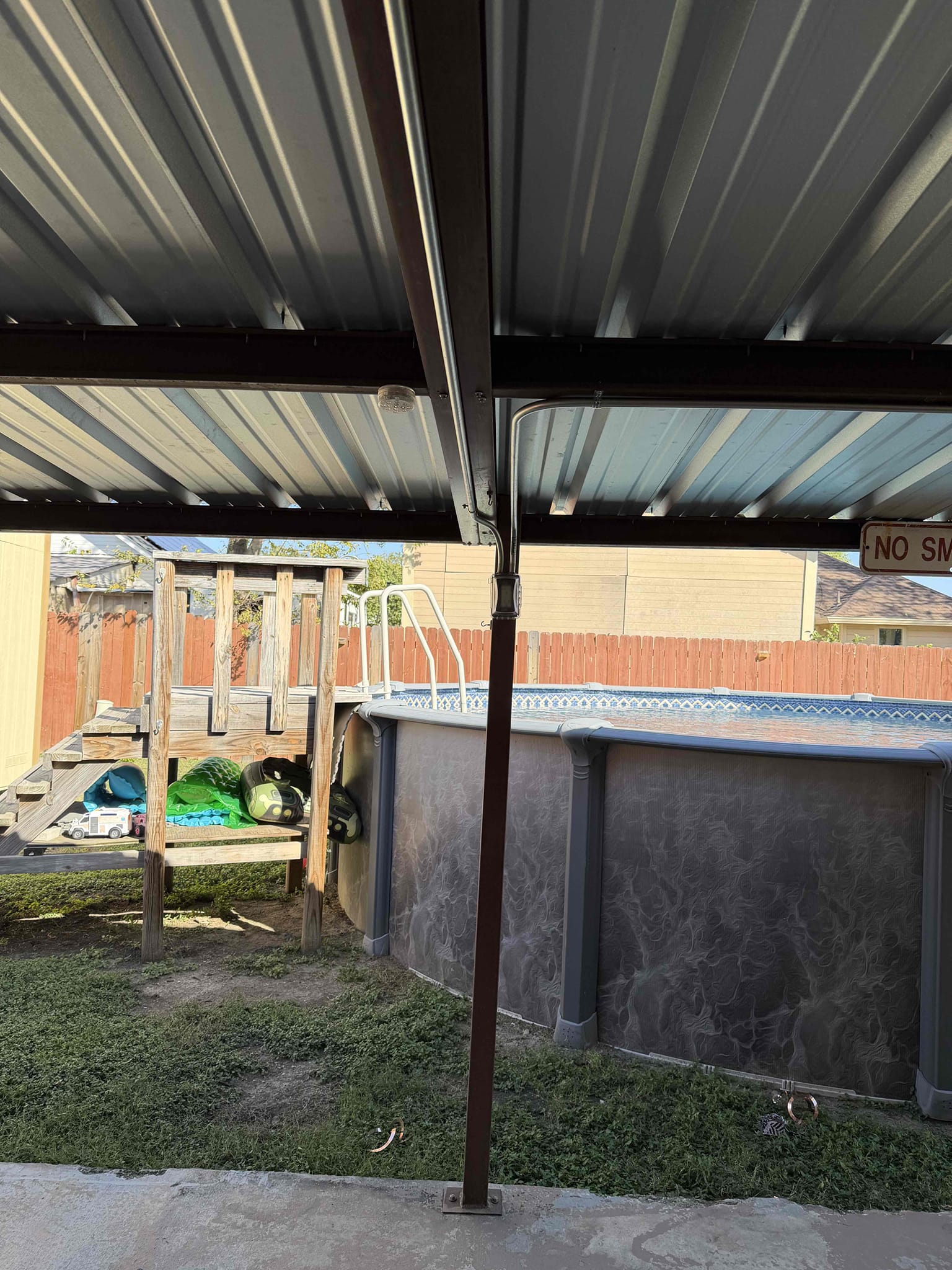 Replace and troubleshoot gfci with cover and siliconed box.
 *5 year warranty only on gfci* 
1. Install whole home surge protection (lifetime warranty) 
2. Install 2 plugs in the back yard 
3. Run conduit In patio 
4. Intermediate troubleshooting in backyard 

*5 year warranty minimum* 

Extended existing soffit outlet circuit to other side of covered patio and ran conduit to two new outlets.  Installed whole home surge protection, and installed slim 2 pole 20 for pool pump and outlets that are sharing neutral.  