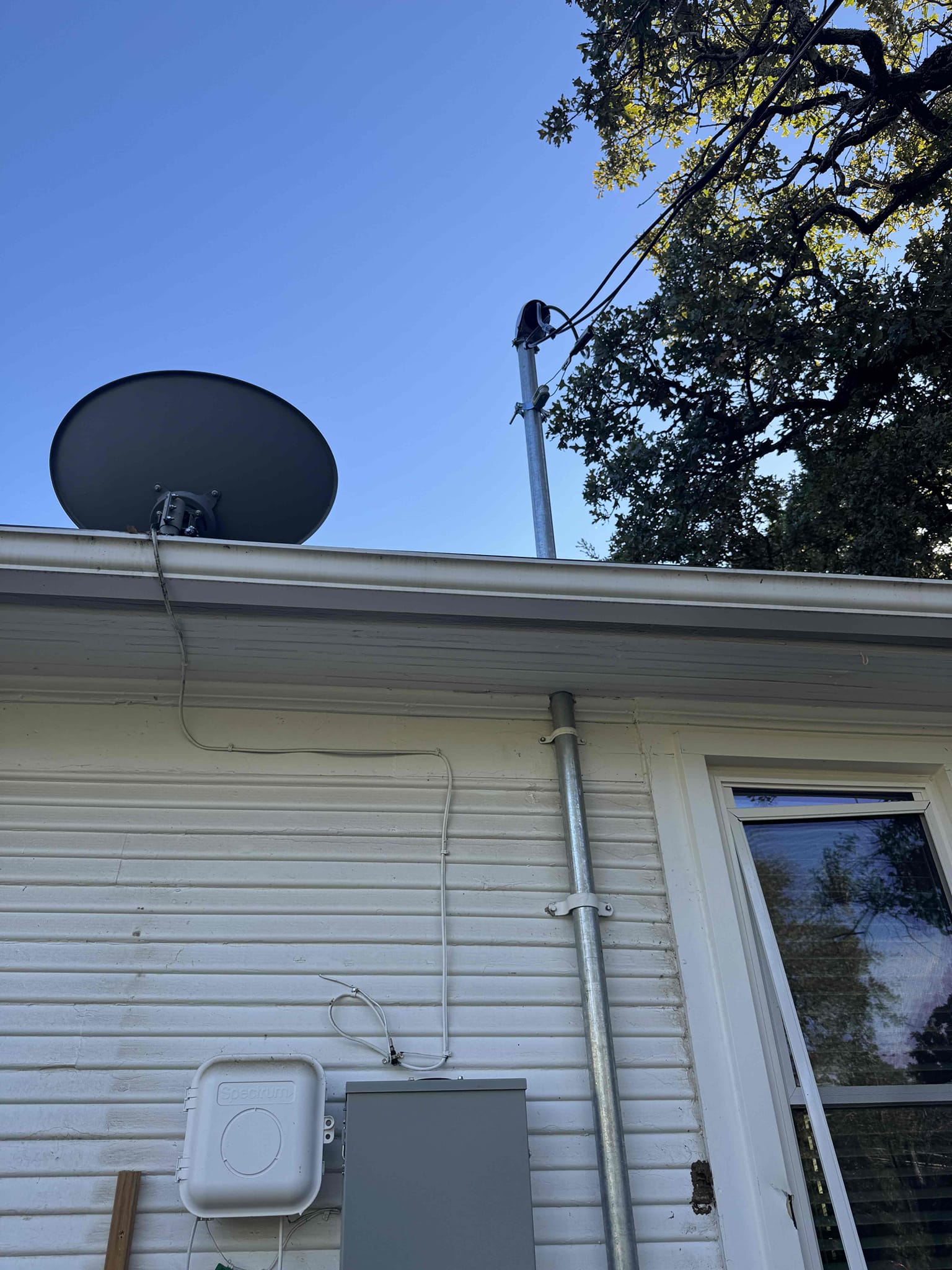 Pull all city permits and inspection, install overhead main electric service (lifetime warranty), install weatherproof main breaker panel next to meter (lifetime warranty), combine outdoor sub panel circuits into main panel, install whole home surge protection on main panel - 108k amps protection (lifetime warranty), install battery powered smoke detectors in bedrooms and hallway in main house, run new 240 volt 40 amp 3 wire feed to garage and install sub panel (lifetime warranty), run new 240 volt 100 amp 3 wire feed to guest house via trench and surface mounted conduit under porch roof, relocate circuits back to back to guest house porch and install weatherproof sub panel (lifetime warranty)