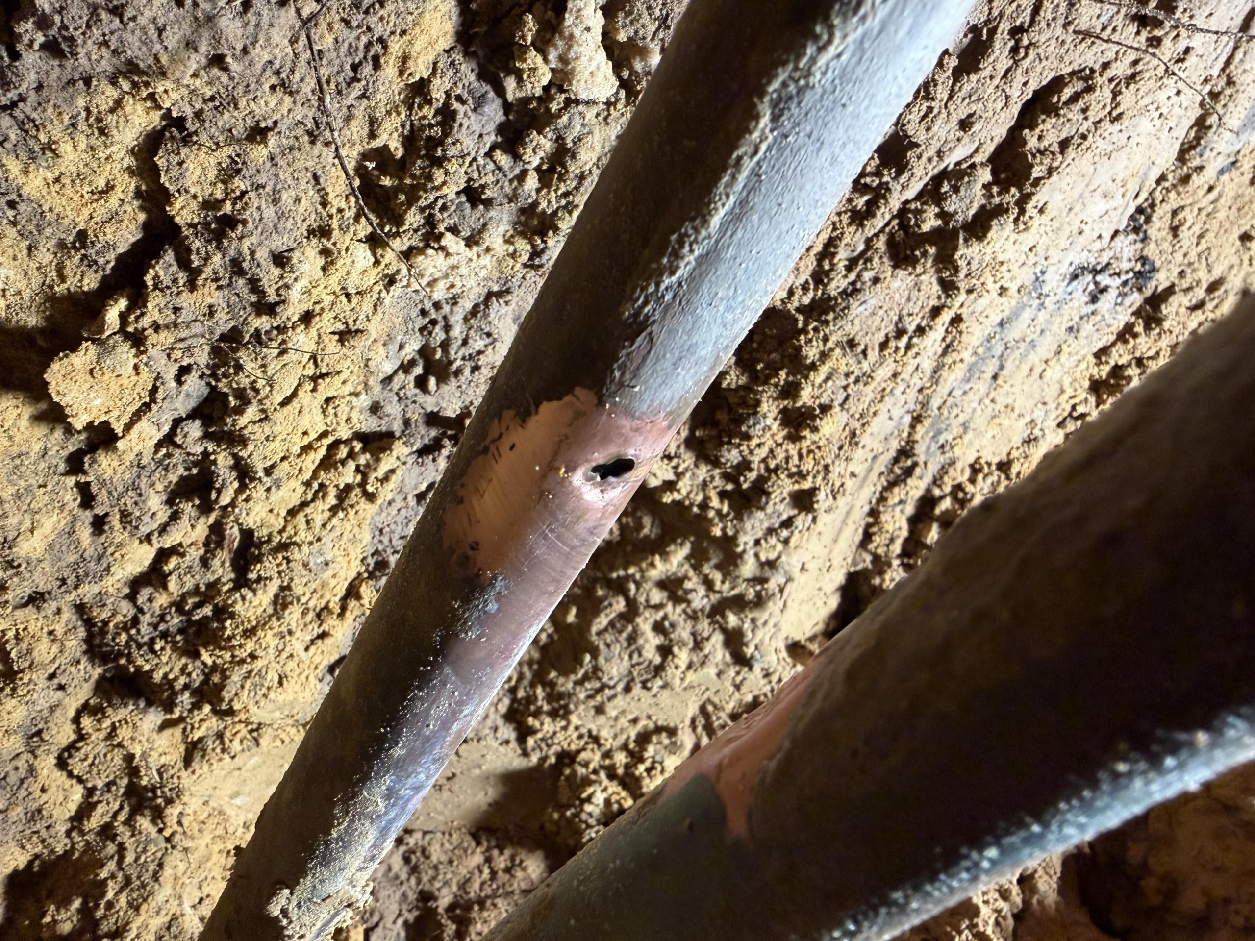 Remove tile flooring and concrete up to 2’x2’ to access underneath slab for water line repair. Braze compromised water line. Not responsible for tile repair. Estimates does includes placing dirt back and pouring new concrete on the hole. 1 year warranty for repair due to age of system. 

Remove tile in kitchen. Chipped and removed concrete in kitchen. Excavated approximately 1 foot to attempt to locate waterlines. Upon excavation water was running and the leak was found to be underneath A portion of the concrete slab that is under a wall and water heater, and HVAC stand in garage. Further work is necessary to complete job
Remove tile flooring and concrete up to 2’x2’ to access underneath slab for water line repair. Braze compromised water line. Not responsible for tile repair. Estimates does include placing dirt back and pouring new concrete on the hole. 1 year warranty for repair due to age of system. 

Cut wall material as needed to gain access to manifold. Reconfigure manifold to ca