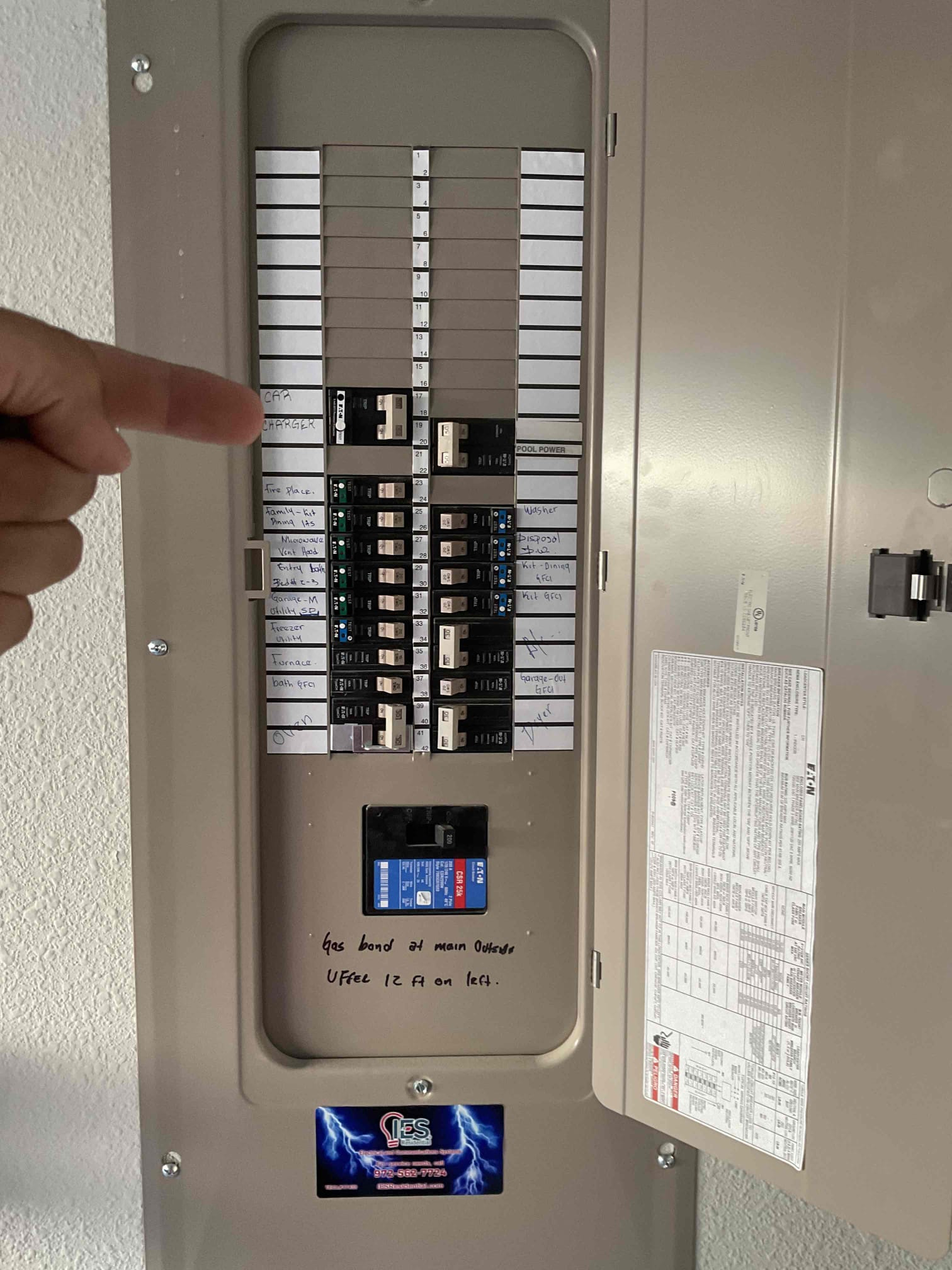 Arrived on job site. The customer requested a car charger installation for her new Porsche and specified that she wanted a plug-in 240V circuit style. Installed a 50-amp GFCI CH two-pole breaker connected to a NEMA 14-50 EV charger outlet located beneath the panel. Ran 6-3 wire from the breaker to the outlet to supply power, and also mounted the Porsche charger on the wall. Walked the customer through how to use the charger and explained that charging should be limited to 80% capacity, with a maximum output of 40 amps on a 50-amp breaker. The customer was fully satisfied with the installation and acknowledged the five-year warranty covering all work, labor, and materials.