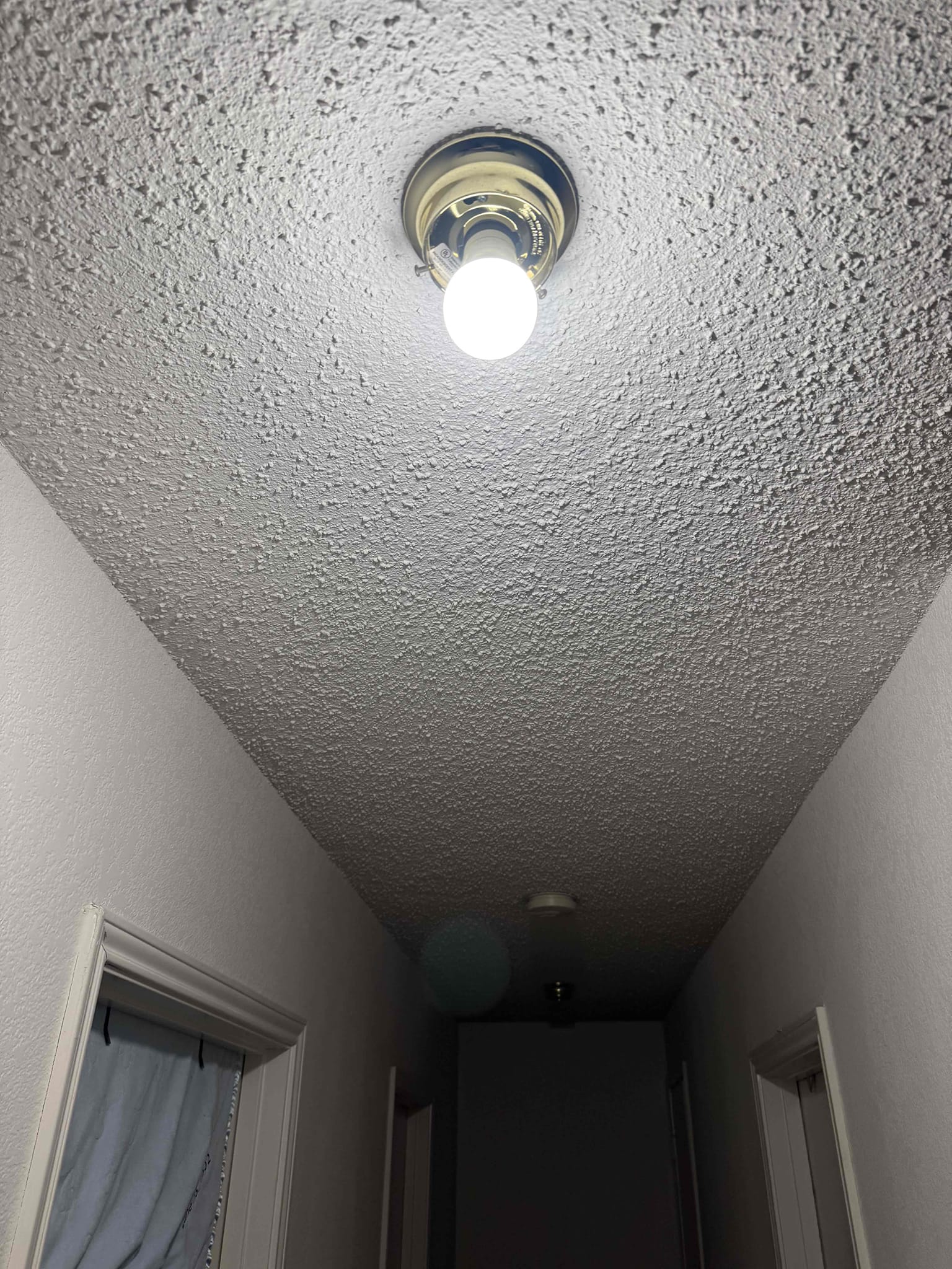 Customer had a burnt neutral wire on a light fixture with a broken socket and pull down fixture and realized that the wire was burn recommended not installing back up after repairing. So swap the two fixtures in the hallway and put the good fixture where she wanted light and installed a new lightbulb and everything worked with no issues and installed the bad fixture where she didn’t want a light fixture and just did not hook back up due to it being burnt. Explain to customer that she can buy a life fixture from any hardware store, including Home Depot and we can come back out and install it.
