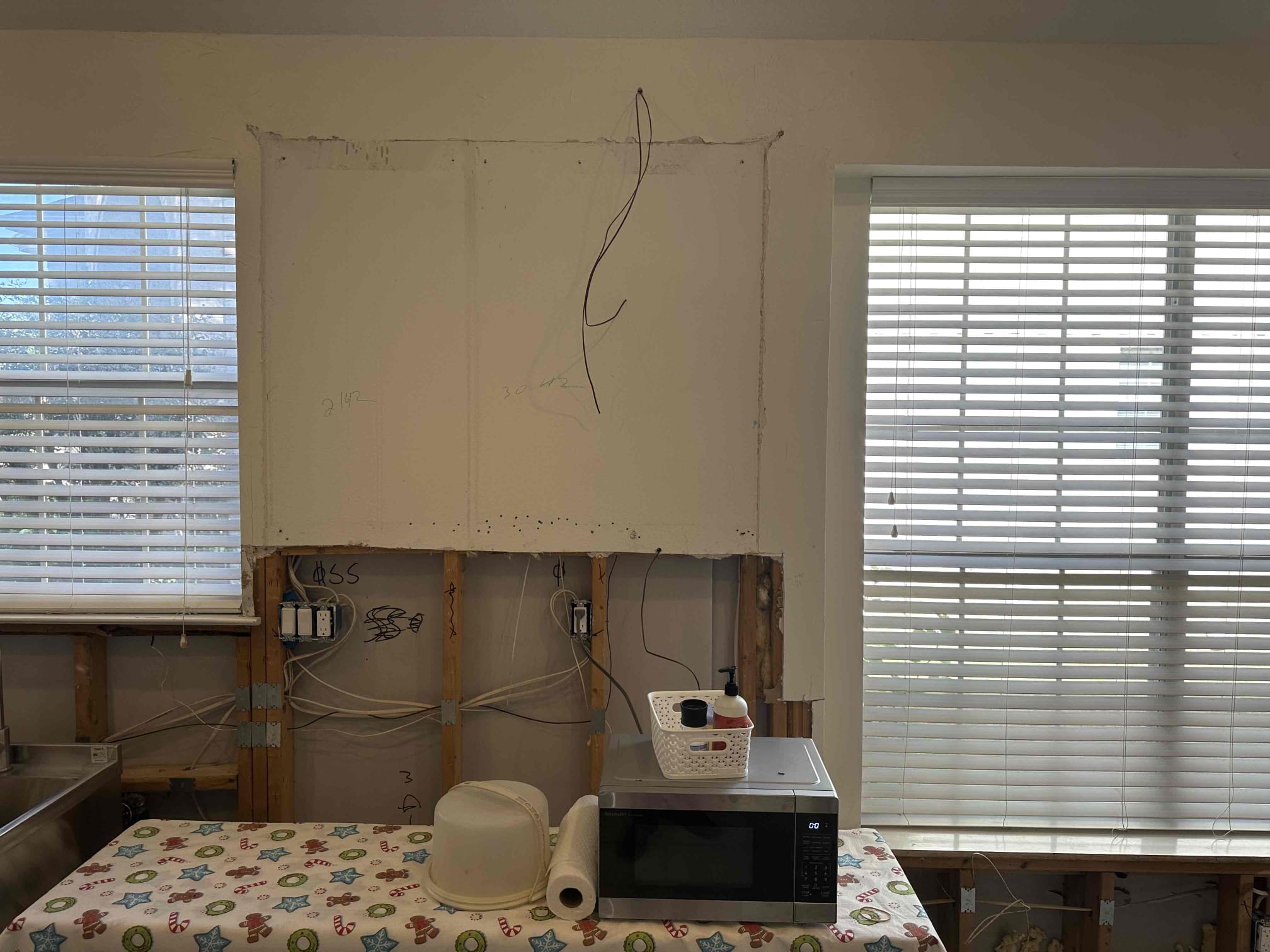 Replacing all outlets and switches in kitchen, extending microwave circuit in concrete to island, adding led strip lighting for kitchen cabinets, adding a new outlet and switch on the opposite side of kitchen, installing a light in cabinet on the far side kitchen cabinet, adding a switch for led lights with a dimmable transformer, pulling a permit for all electrical work. (Will be coming back out Friday to complete rough in and will need to schedule another day for trim out)

Ran low voltage control wires to all spots that will have tape lighting installed once cabinets are up.  Relocated outlet over closer to fridge for counter top outlets, and installed switch leg for tape lighting in same box.  Replaced all existing devices in kitchen, and ran power to opposite wall and left in wall ready for outlets when cabinet goes in.  Installed j box in the attic and ran existing old range power to wire going down through conduit in concrete for island microwave outlet.  