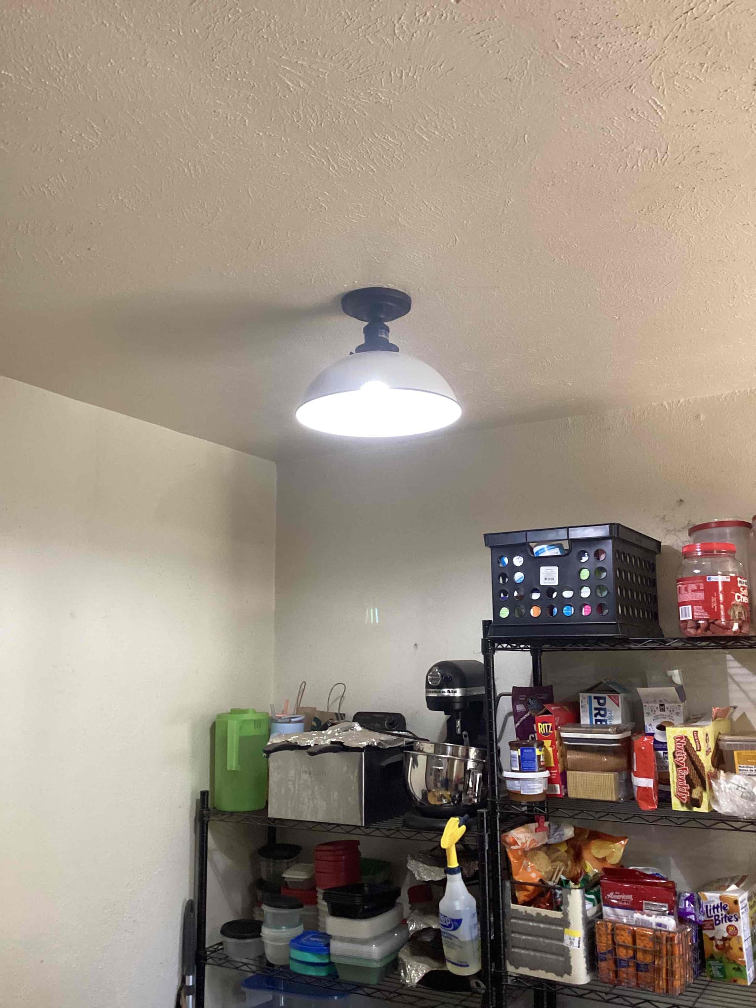 Tuesday morning closed off 2 open splices in attic re ran 1 Switchleg to the dining room light also replaced fixture re ran power to switch due to bad wiring ran new Switchleg to light over kitchen counter added pull string light for customer also replaced floodlight in front garage 