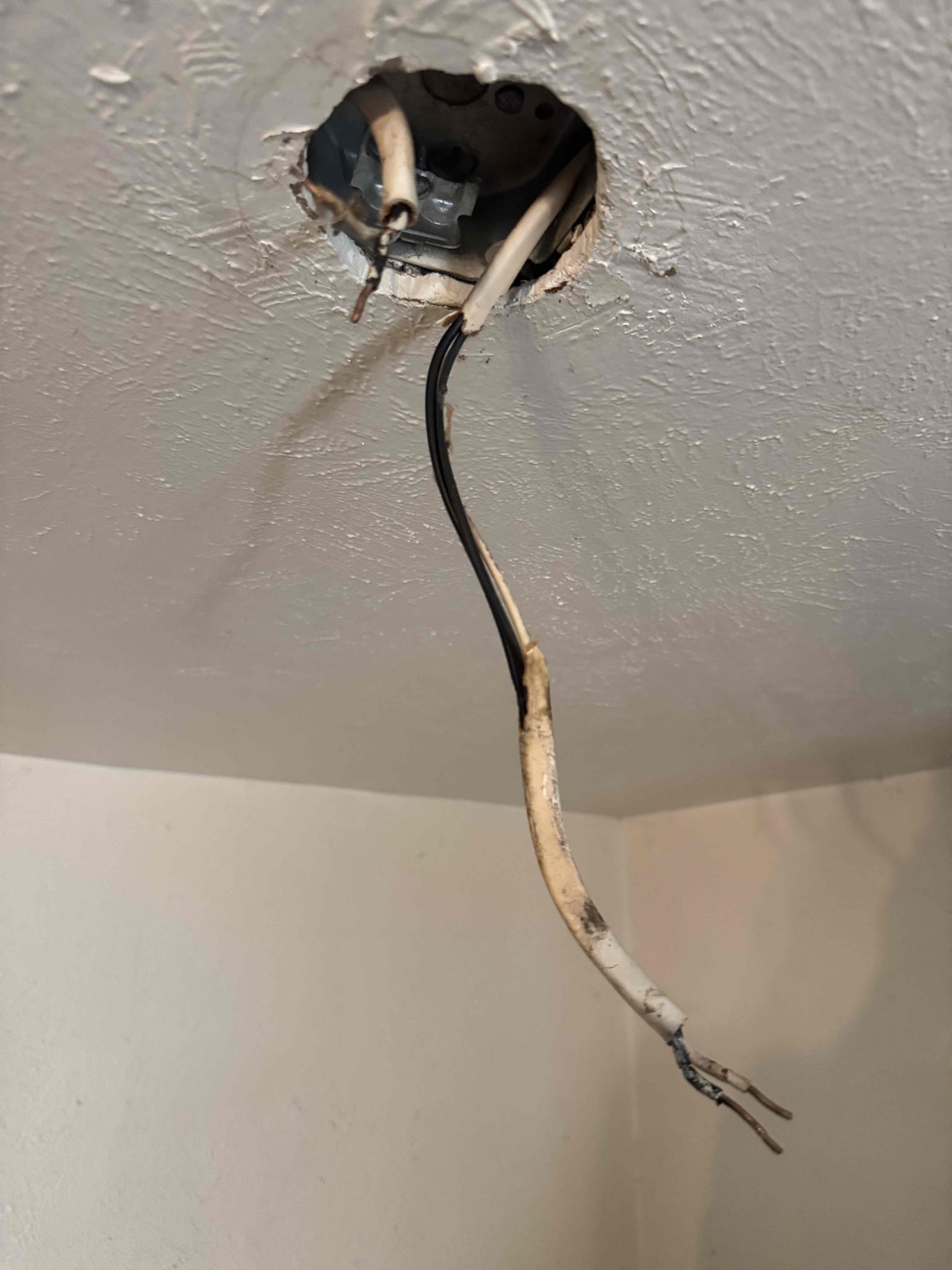 Tuesday morning closed off 2 open splices in attic re ran 1 Switchleg to the dining room light also replaced fixture re ran power to switch due to bad wiring ran new Switchleg to light over kitchen counter added pull string light for customer also replaced floodlight in front garage 