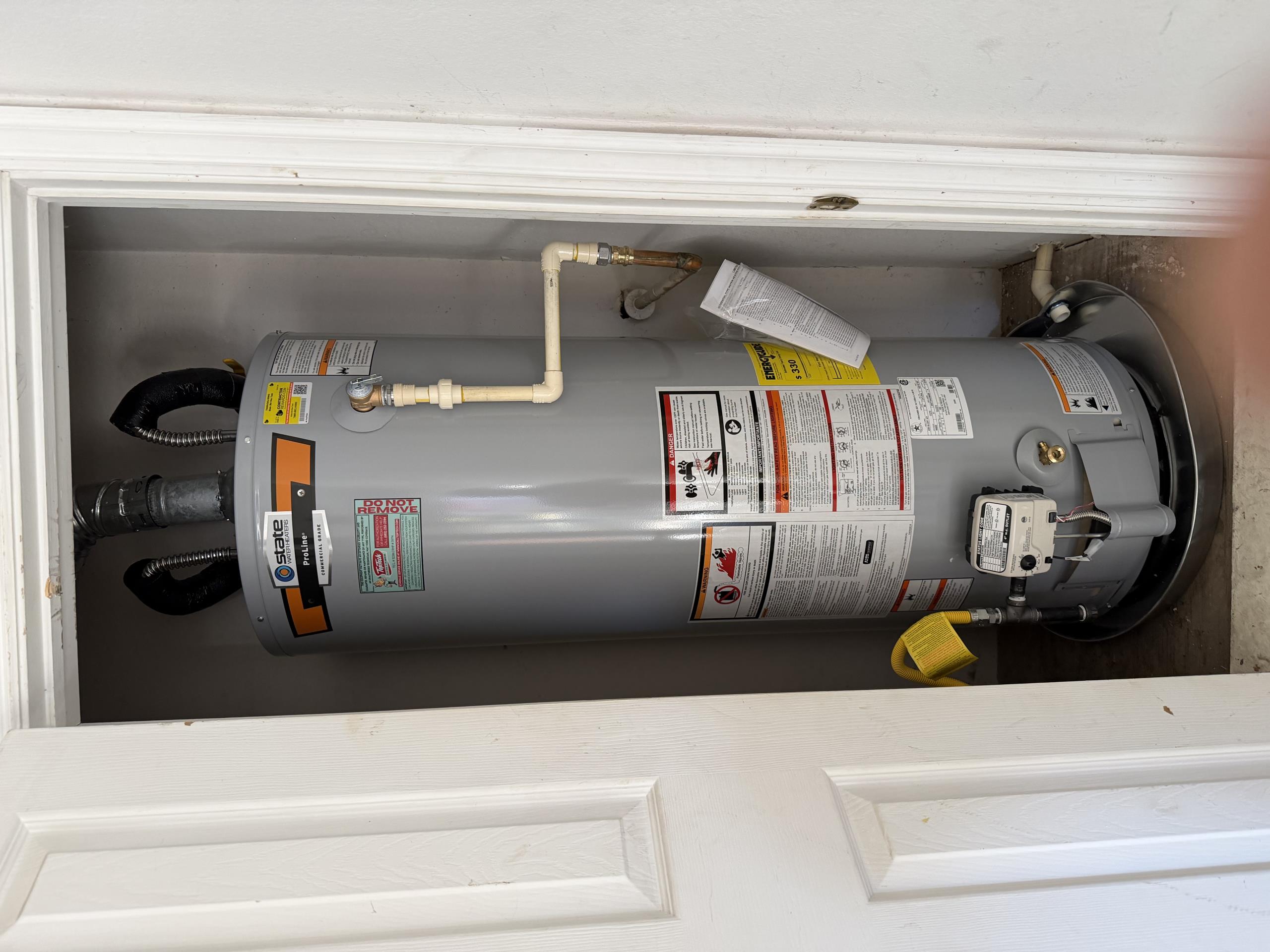 Remove and dispose of existing water heater. Replace water shutoff and supply lines. Replace gas flex and add sediment trap. Install pan with drain to floor of garage. Reconnect to existing flue pipe and t&p discharge. Provide city permit and inspection. 6 year warranty on parts and labor. 

Install 50 gallon gas water heater in customers garage. Ran new pan drain line outside. reconnected to existing TMP line. Install two new full port hot and cold water shut off valves. Six year warranty on parts and labor. Paid with cash. Job complete.