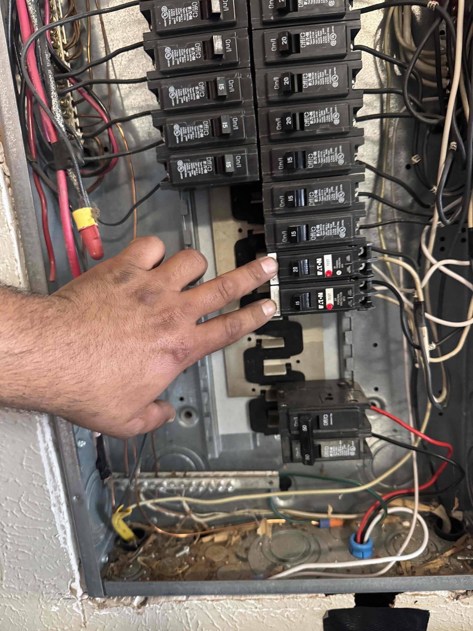 Arrived on the job site. The customer stated that his outdoor outlets, including the restroom outlets, were not working. Upon inspection, I found a tripped GFCI that controls both the outdoor and restroom outlets. I reset the GFCI but noticed the breaker was difficult to reset and was an older-style BR GFCI breaker.

I explained to the customer that the trip likely occurred for a reason and recommended replacing all outdoor outlets with new ones equipped with bubble covers and sealed with silicone to prevent water or moisture from entering and causing future trips. I also advised replacing the restroom outlets due to their age and condition.

Additionally, we will be replacing two GFCI breakers — one 15-amp breaker controlling the outdoor and restroom outlets, and one 20-amp breaker controlling the pool light, as indicated on the panel cover. Since both are older-style BR GFCI breakers, replacement is recommended.

The customer is 100% happy and satisfied with today’s visit and underst