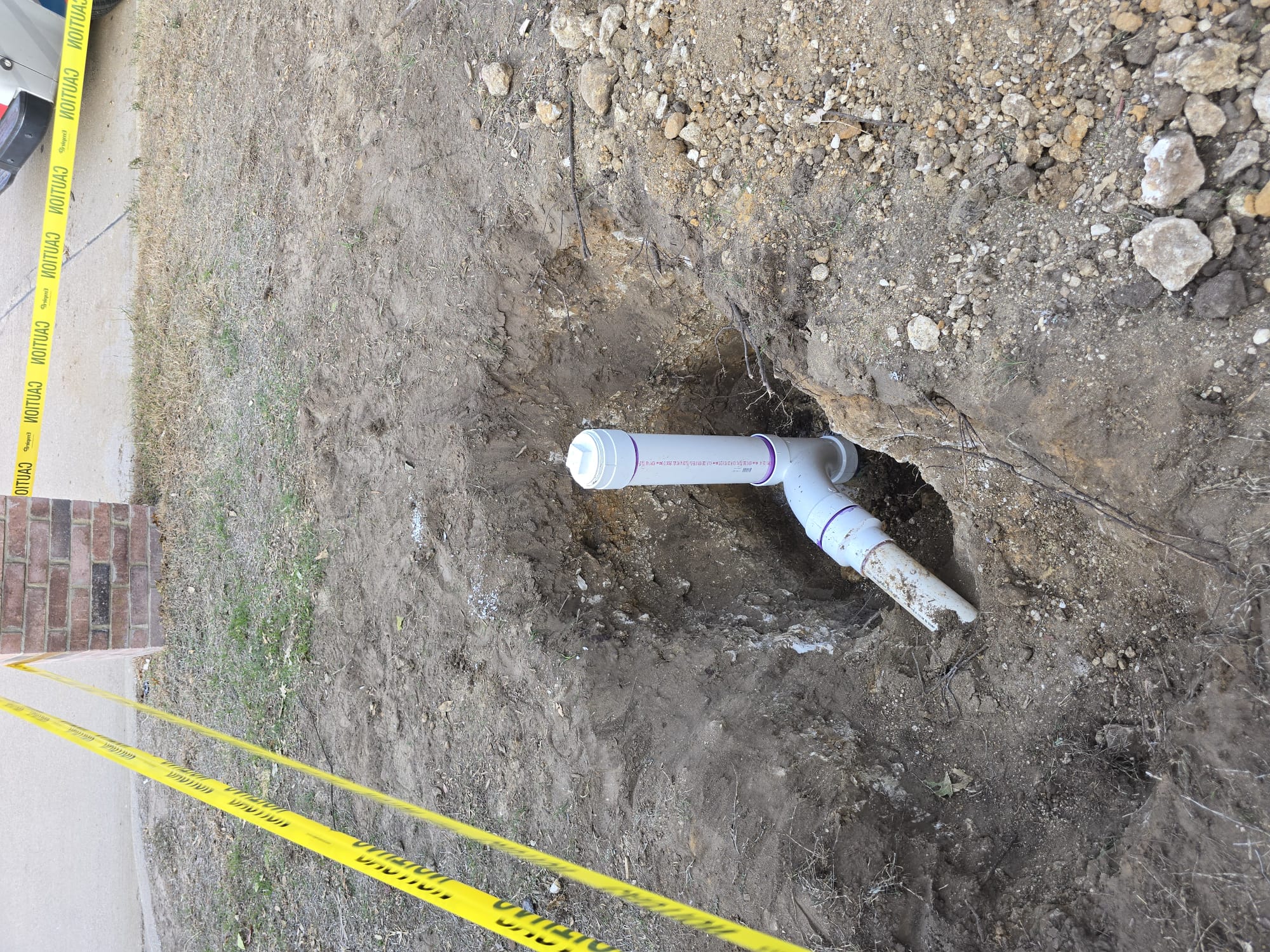 - Attempt to pop clog in drainage toward street due to cleanouts full of water.
- preform sewer camera inspection on main line to check for any issues / defects in piping.
 - locate issues with special equipment 
Solutions will be given for any issues found
Excavate up to 3’x3’x3’ in order to gain adequate access to compromised sewer connection. Cut out affected pipe and replace, install cleanout fitting with riser and cap. Provide city permit and inspection. 5 year warranty on parts and labor. 