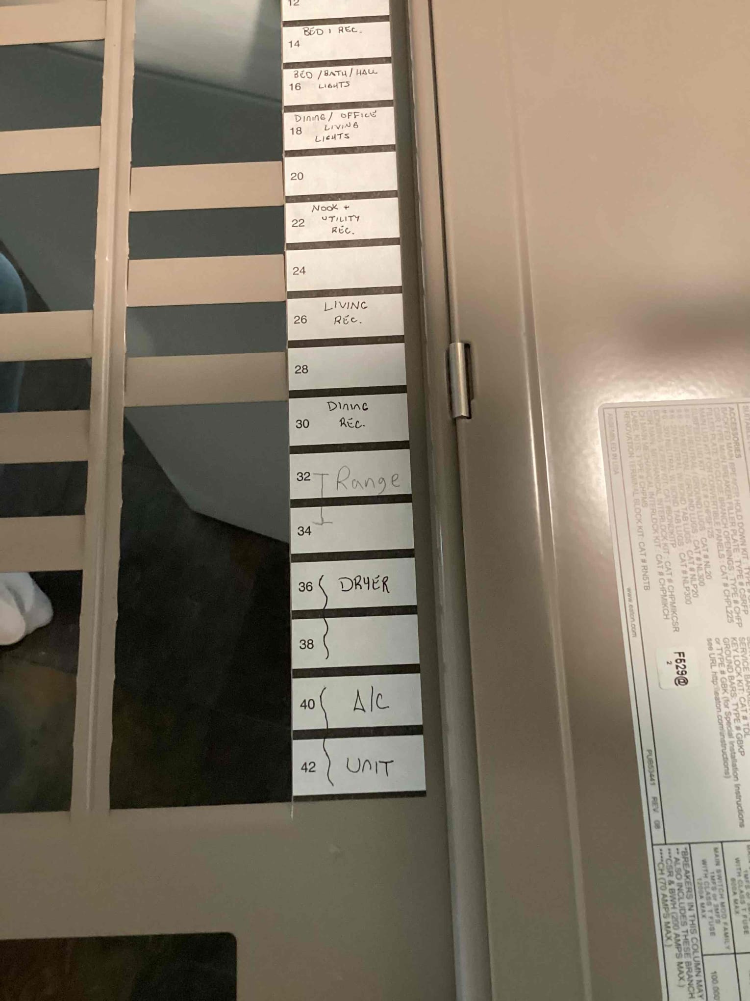 Met homeowner onsite and answered all questions about the electrical system. Found that the unlabeled breaker was for the range. The breaker with the the light constant on it operational and is functioning it is just a small manufacturer defect the does not effect operation.