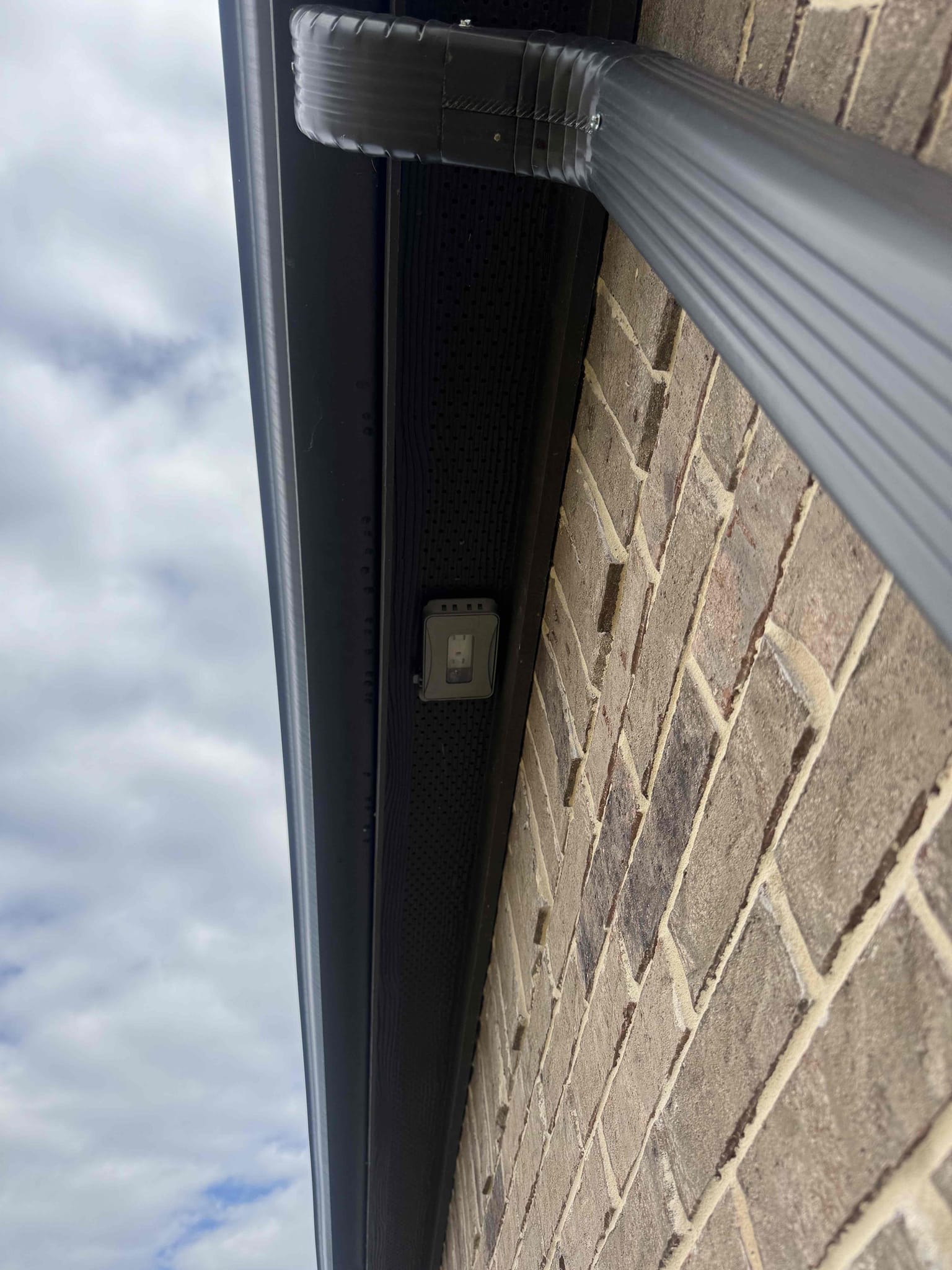 Arrived on the job site and the customer requested multiple EV outlets to be installed. We will be installing four EV outlets at the front entry of the home—one on the far right corner, one on the far left corner, and two in the middle section. We are also adding an outdoor outlet on the back patio ceiling and replacing the existing back patio ceiling fan. Additionally, we are installing a Ring doorbell, a customer-supplied smart switch inside the home, and a customer-supplied timer that will control the outdoor outlets. We will be returning on Friday to complete all work.