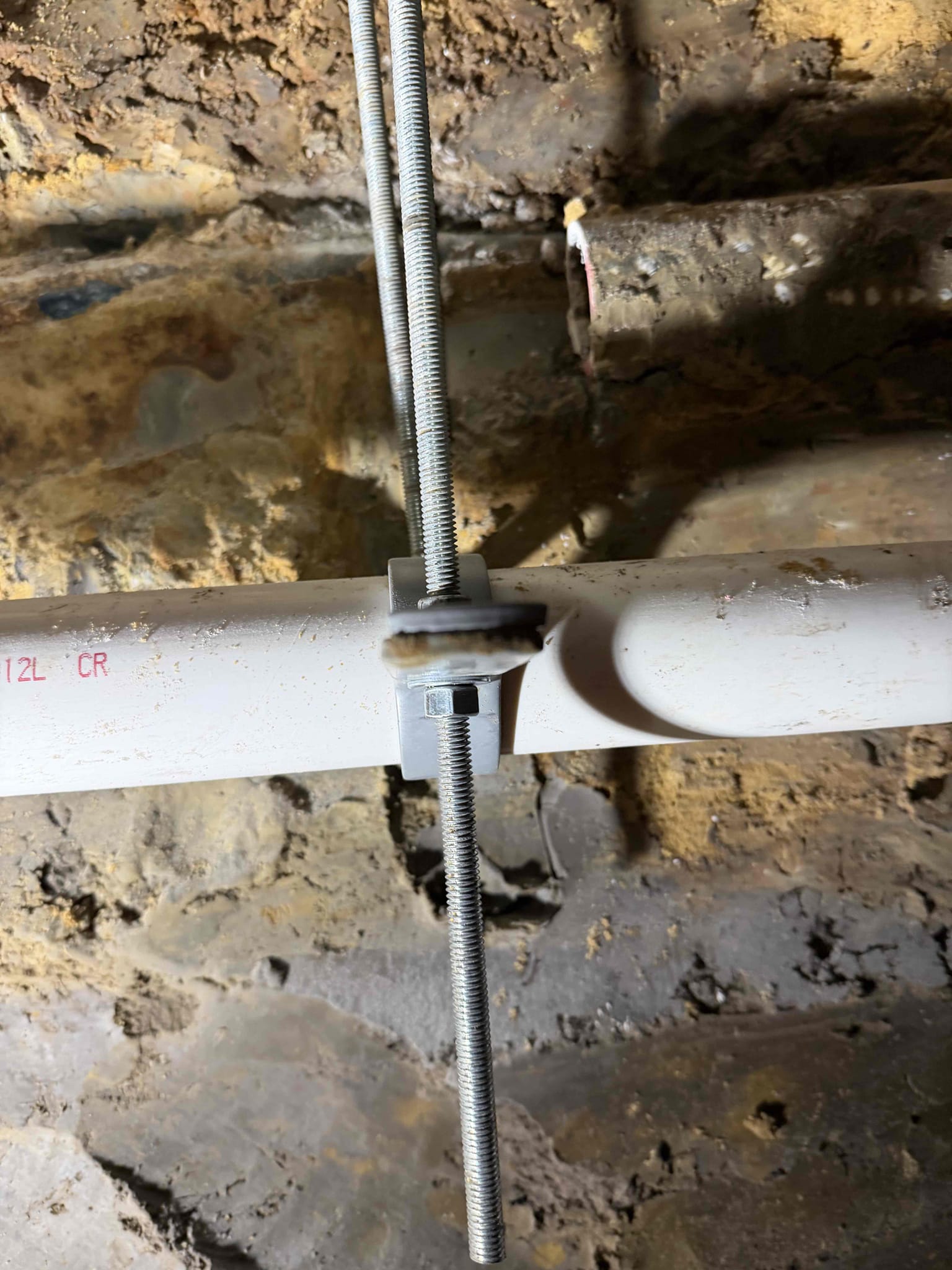 - attempt to pop clog on kitchen sink due to complete backup
Preform camera inspection on kitchen drain to look inside drain and figure out what defect or problem was causing this issue.

** solutions will be given for any issues found **
Excavate access hole on exterior of home 
Tunnel under the slab to expose the kitchen drain to the end of the bellied section 
Cut out bellied section and repipe with proper pitch securing pipe to the underside of the slab to prevent shifting and settling 
Backfill and compact
15 year parts and labor warranty on pipe installed
No landscaping included

Repaired approximately 25 feet of laundry line underneath customers home. Ensured proper grade and secured with proper hangers. Job complete. Paid with check 