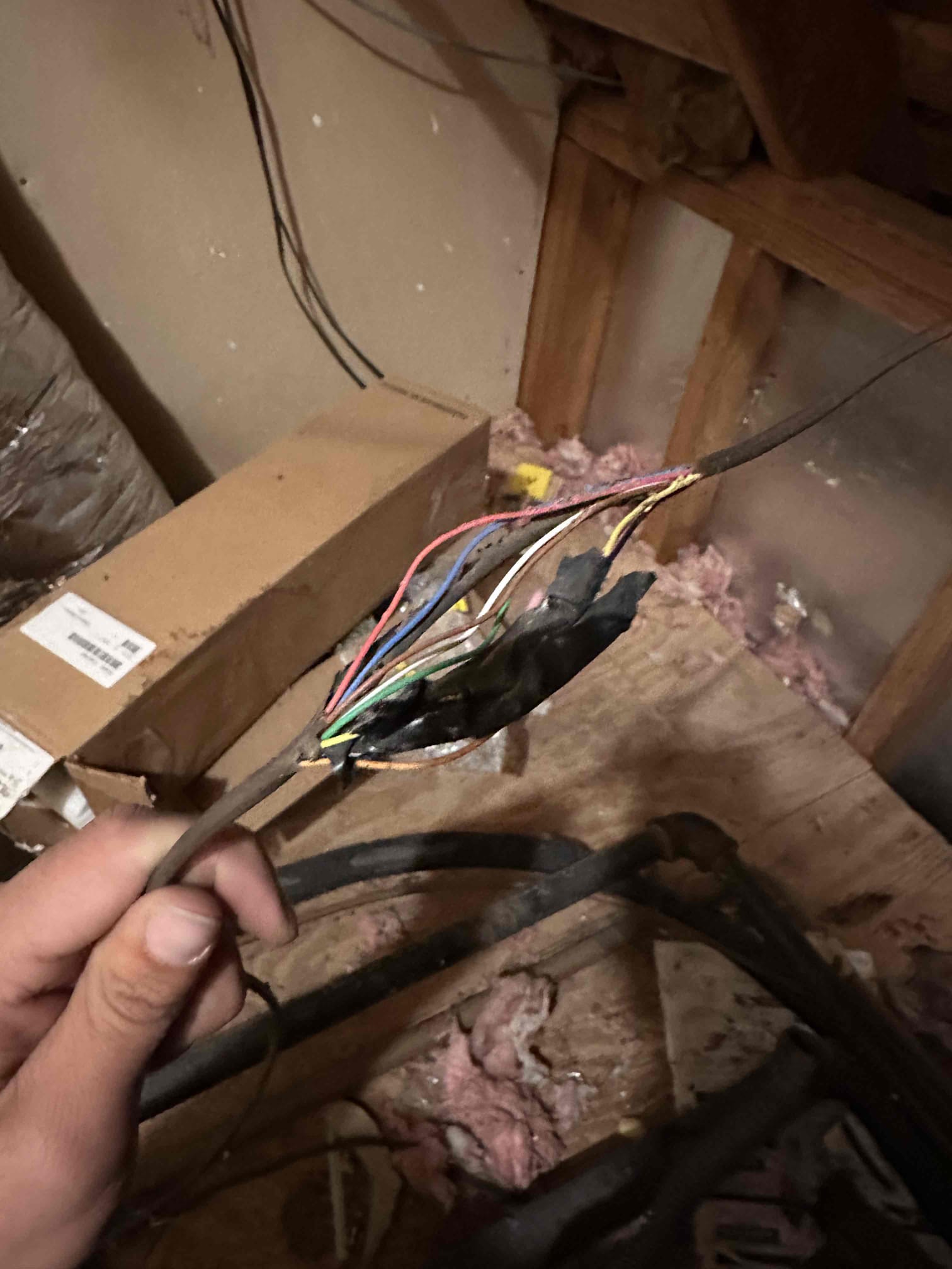 Arrived on the job site, and the customer reported that rodents in the attic had chewed through the air-handler wiring. We will return tomorrow morning to run a new line through the existing PVC-protected junction box on the eave and extend the wiring to the air handler. We will also be replacing a couple of customer-supplied breakers. The customer is fully satisfied with today's visit and understands that there is a five-year warranty on the junction box, all connections, and the new wiring to the furnace. The customer also understands that the breaker connections are covered for five years, but the breakers themselves are not.