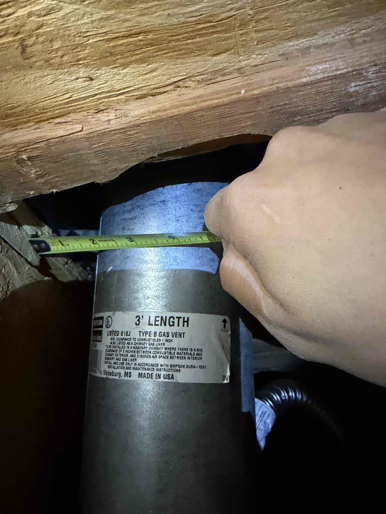Warranty create clearance for water heater flue piping. 