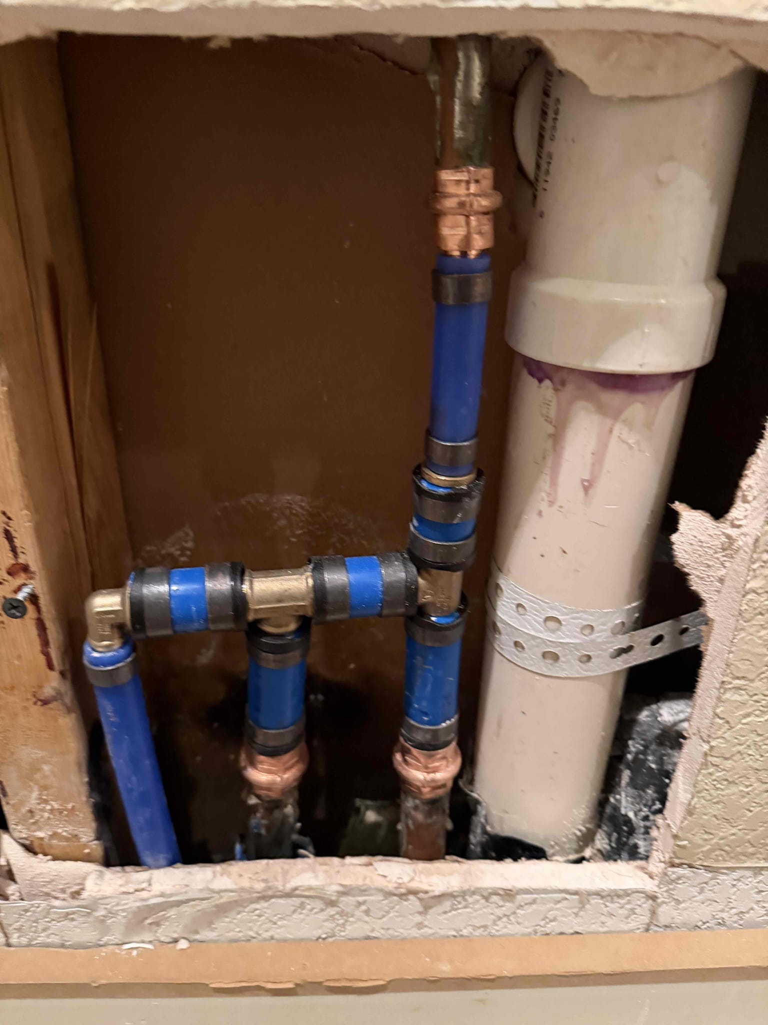 Customer called us out for wetness in gym room near side door.
Looked around home and checked meter twice it’s looking like a cold water slab leak.

Talked to homeowner and will return 2-5 with supervisor for second set of eyes, and to go over options.

Formally recommended turning gas off due to smelling gas in two locations, customer declined.
Repair leak behind bushes, cut corroded pipe and Replace short section with new valve and union. Replace shutoff, union and connections from riser to pool heater. Test system again. 5 year warranty on parts and labor. 
Locate, cut, test and reassemble up to three water manifolds to find compromised water line. Cut wall materials as needed(not responsible for repairs to wall materials). After successfully testing and finding best route, give additional estimate to reroute compromised water line. Test gas system for leaks. If any leaks are present give additional estimate to locate and repair them. 

Repaired 2 gas leaks on system. Preformed gas 
