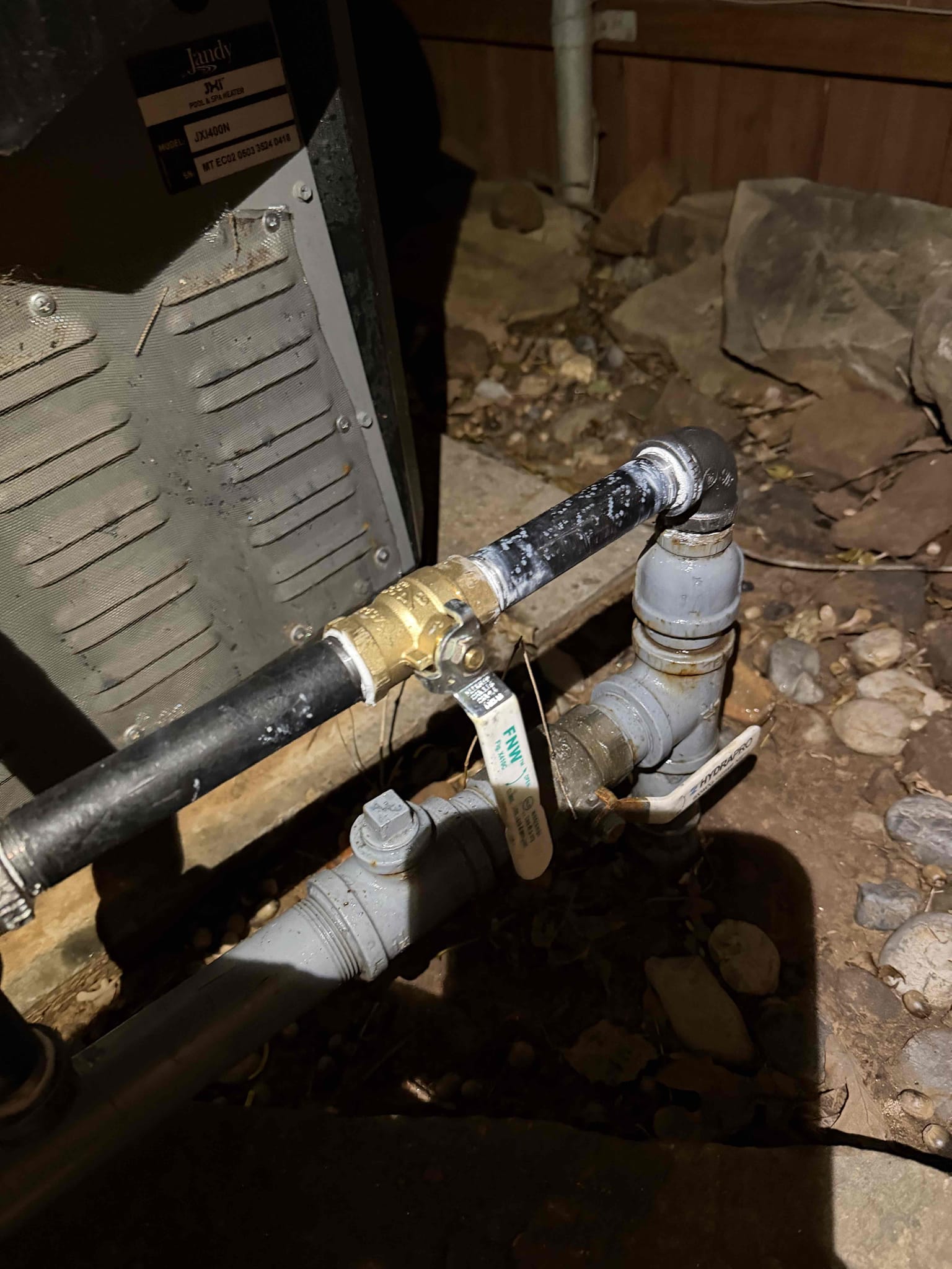 Customer called us out for wetness in gym room near side door.
Looked around home and checked meter twice it’s looking like a cold water slab leak.

Talked to homeowner and will return 2-5 with supervisor for second set of eyes, and to go over options.

Formally recommended turning gas off due to smelling gas in two locations, customer declined.
Repair leak behind bushes, cut corroded pipe and Replace short section with new valve and union. Replace shutoff, union and connections from riser to pool heater. Test system again. 5 year warranty on parts and labor. 
Locate, cut, test and reassemble up to three water manifolds to find compromised water line. Cut wall materials as needed(not responsible for repairs to wall materials). After successfully testing and finding best route, give additional estimate to reroute compromised water line. Test gas system for leaks. If any leaks are present give additional estimate to locate and repair them. 

Repaired 2 gas leaks on system. Preformed gas 