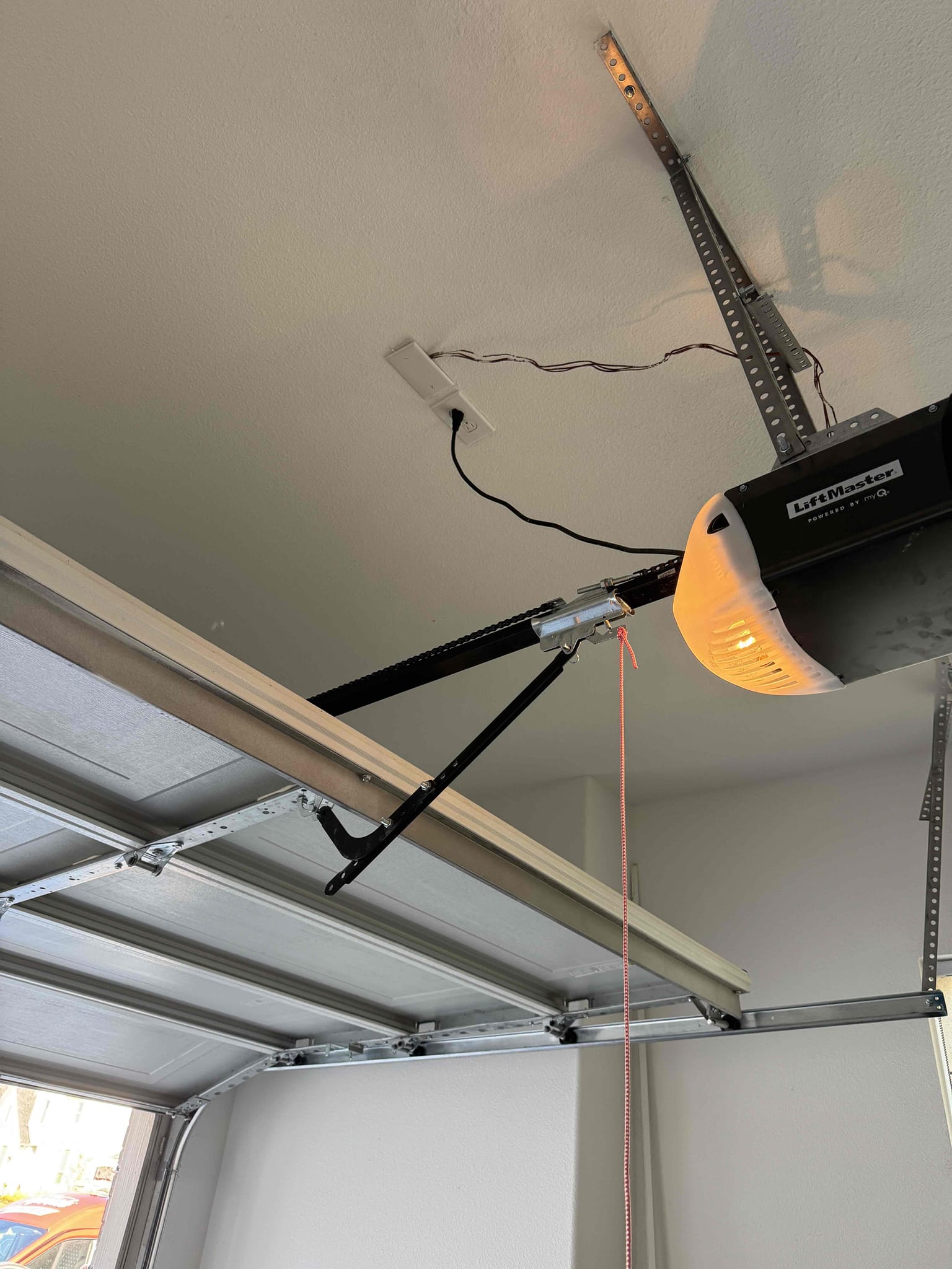 Arrived on the job-site and the customer stated that they recently purchased a Tesla universal hardwired charger they would like installed at the location of the NEMA 14-30 outlet we installed a few months ago. In addition, we will be performing a circuit extension inside the one-car garage to add a dedicated refrigerator outlet. We will be returning later today to complete the work, and Hector will be the installer. He will be handling both the hardwired charger installation and the circuit extension. All work we perform comes with a five-year warranty. The customer is 100% happy and satisfied with today’s visit.