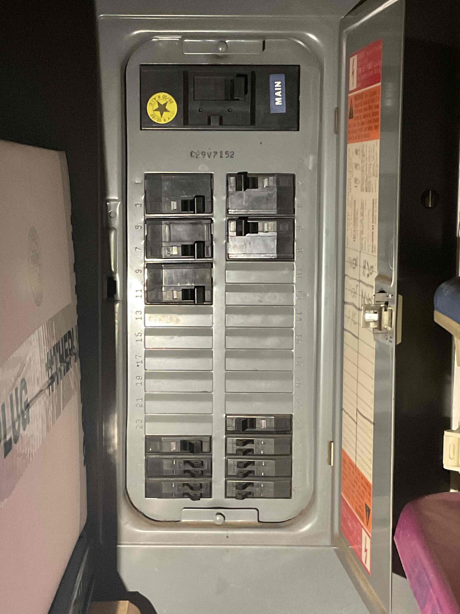 Customer called about a power loss to the back left bedroom and bathroom circuit. Found tripped breaker (bottom right). Breaker was difficult to reset due to age. Reset breaker and restored power to the circuit. Informed customer that the small space heater that was being used was drawing 12.5 amps on a 15 amp circuit. Customer also stated that they had an electric fireplace on the same circuit but has since sold it. Customer had an extension cord plugged in to the living room outlet. Outlet was hot to the touch. Recommended replacing the original panel as well as replacing devices