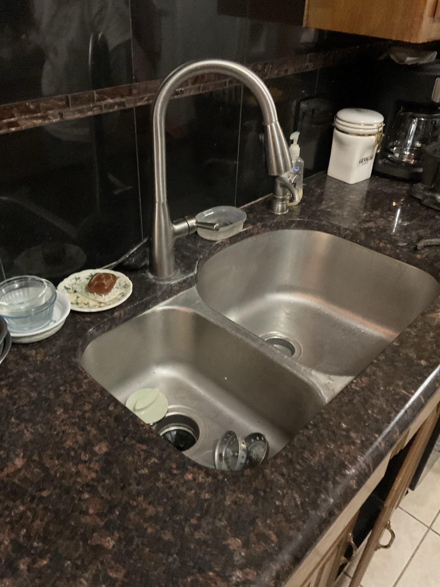 Upon arrival customer directed me to the kitchen sink. The sink was backed up. Ran drain cable and restored flow. Had significant resistance while running cable. Recommended camera inspection. No warranty on drain clear. Ran water to check for leaks on tubular drainage under sink. Customer paid with $100 bill. 