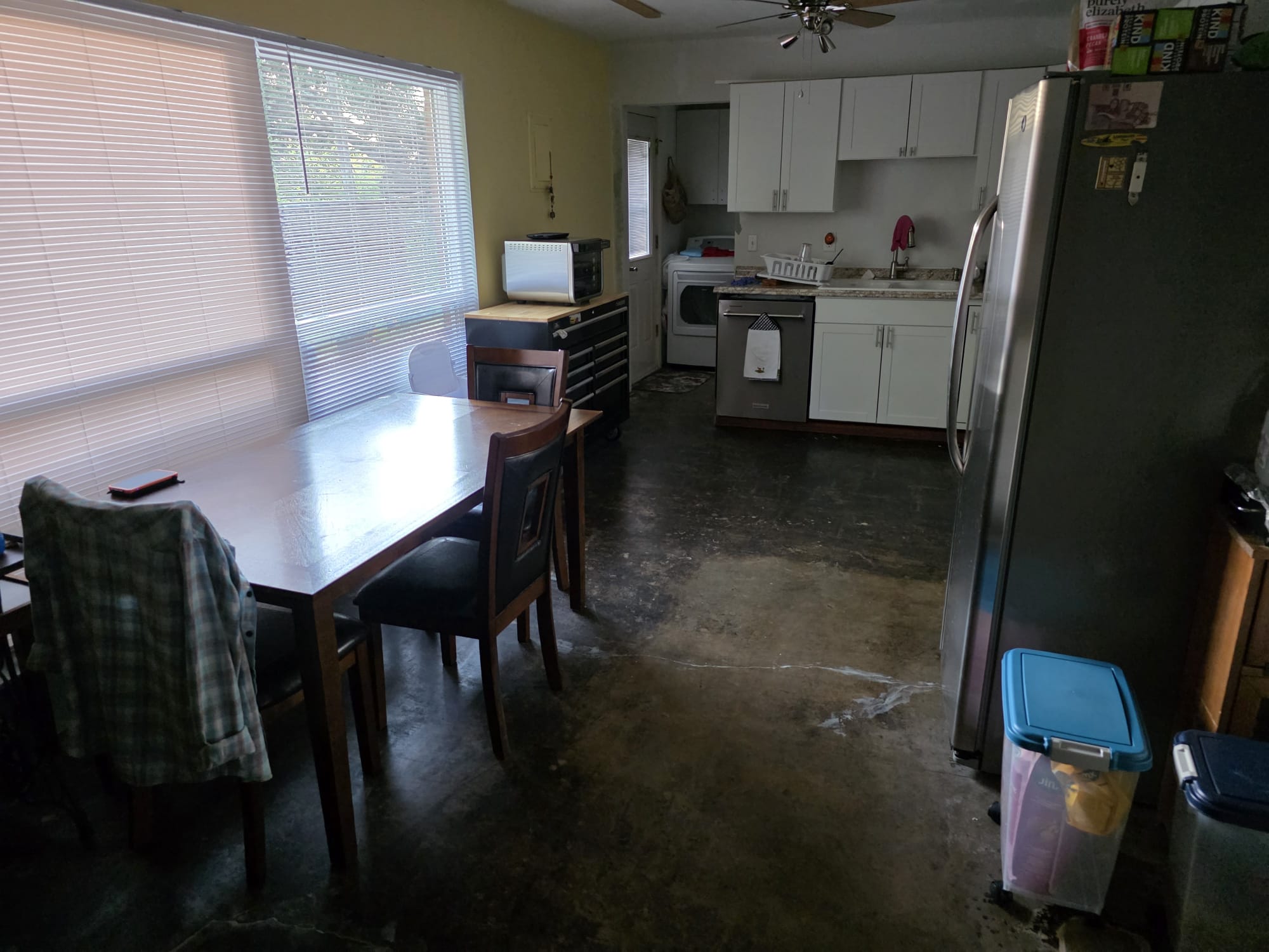Excavate tunnel from the exterior of the home to the break in the cast iron kitchen line
Cut out and replumb the kitchen and laundry drains under the slab up to that point connecting on to the rest of the line
Properly secure the pipe to the underside of the slab
Have new pipes inspected by the city inspector 
Backfill and compact
Hydrojet main sewer line to remove roots
Repair water line inside wall behind laundry replacing shark bite fittings with proper copper fittings
Under kitchen sink, cut back galvanized nipple, transition to pvc and re pipe the tubular waste with a continuous waste tee and new p trap
Replace laundry hot and cold valves
15 year parts and labor warranty on pipe installed