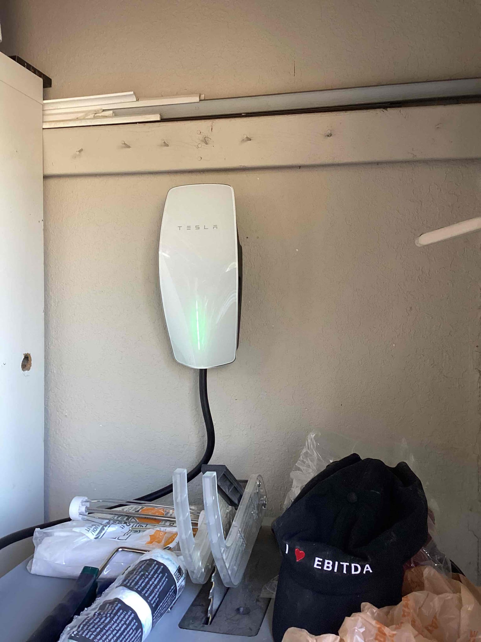 1. Install electric car charger in garage 
2. Run #6 wire across attic and down wall
3. Install conduit out of panel to ceiling 