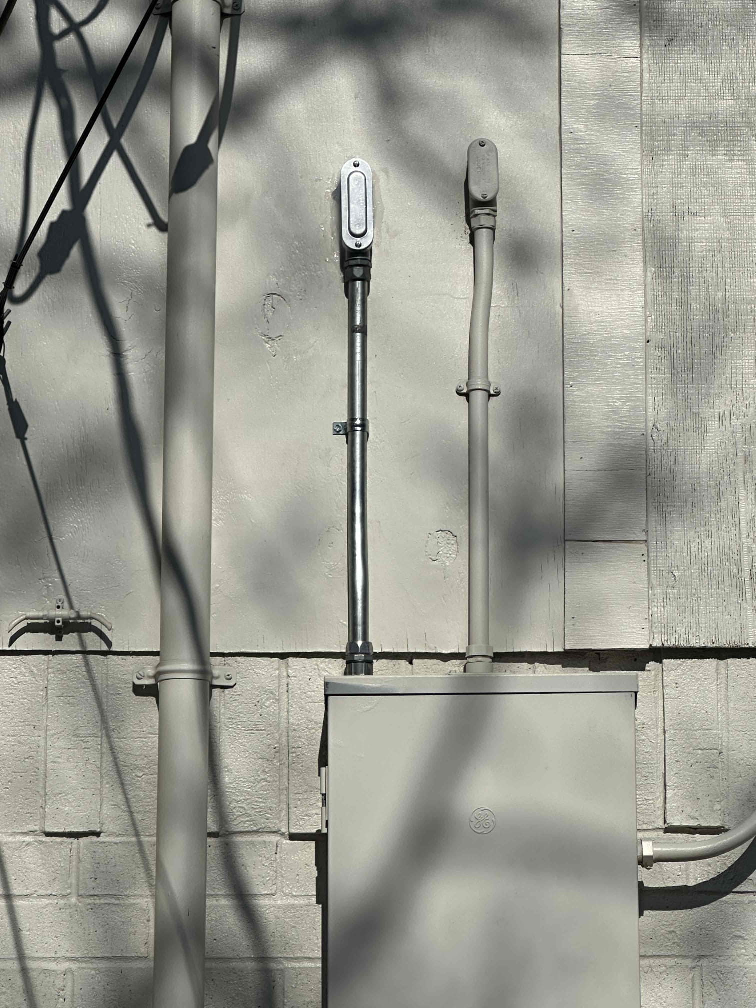 1. Install electric car charger in garage 
2. Run #6 wire across attic and down wall
3. Install conduit out of panel to ceiling 