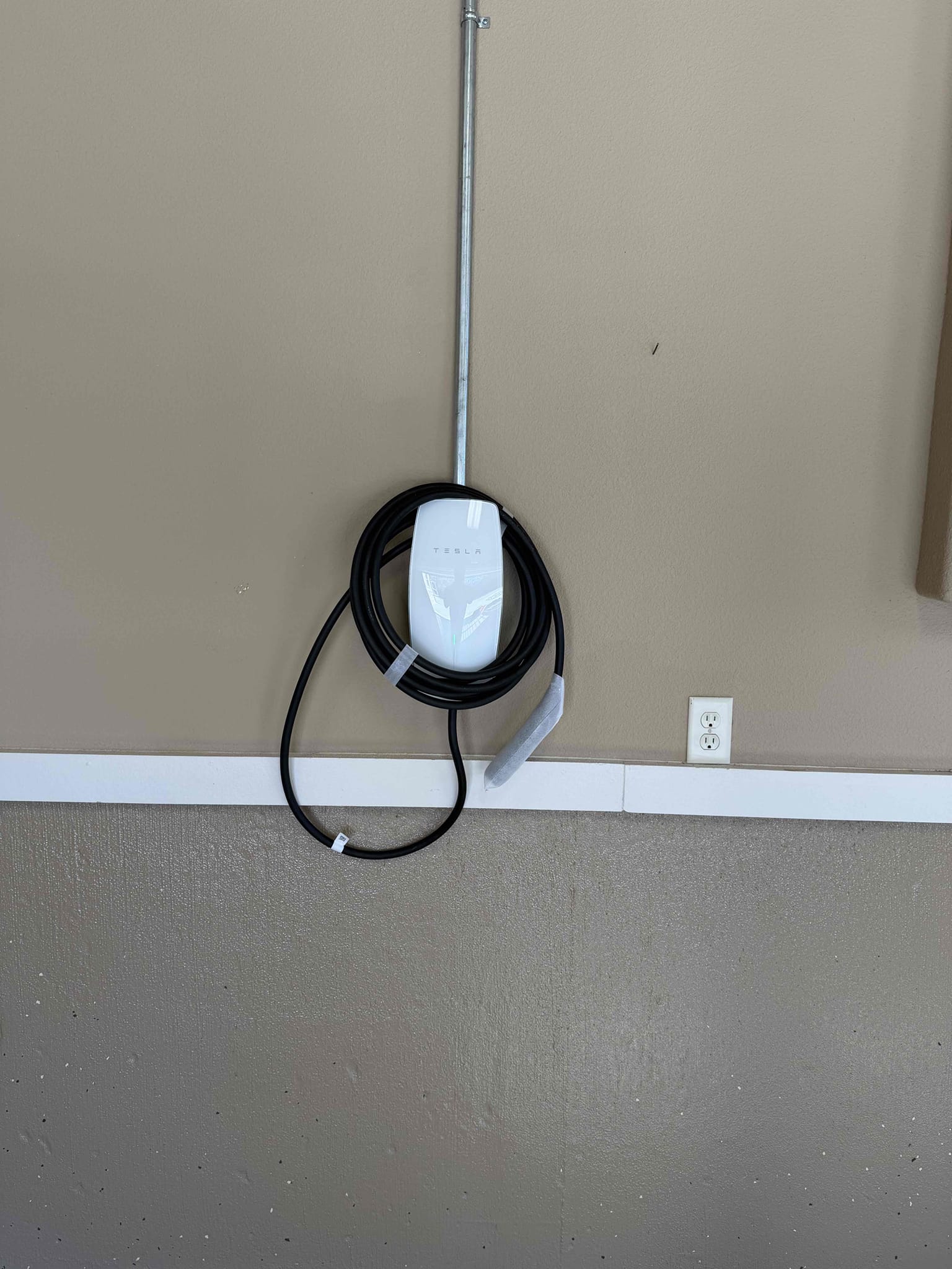 Arrived on a ride-down job site where the customer requested the installation of two Tesla Wall Chargers. We will return tomorrow morning to complete the installation. The scope of work also includes installing a whole-home service protection device with a lifetime warranty, providing protection up to 108,000 amps. The Tesla Wall Chargers, including all wiring, connections, circuit runs, and breakers, will carry a five-year warranty. The customer is 100% happy and satisfied with today’s visit.

Ran 2 dedicated 60 amp circuits from main panel across garage to separate locations and installed two Tesla EV chargers.  Installed whole home surge protection on panel.