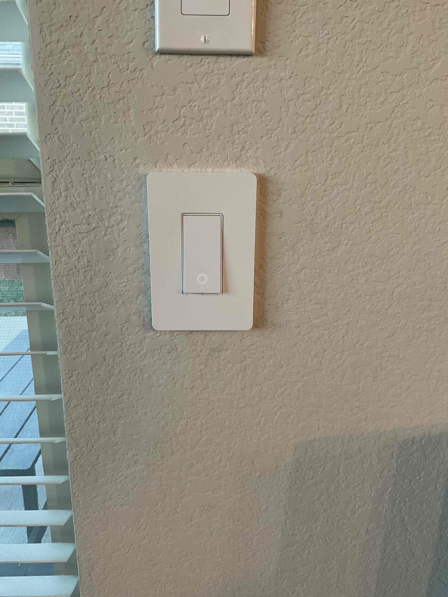Arrived on job site; customer stated that the light switch controlling the back patio porch light was not working properly. Upon inspection, determined it was a smart switch that was continuously blinking and had failed. Customer confirmed that no other devices or circuits in the home were affected and that the switch was the only issue. Replaced the faulty switch with a customer-supplied device. Verified proper operation after installation. Provided the customer with options for adding surge protection. Customer is 100% happy and satisfied with today’s visit.