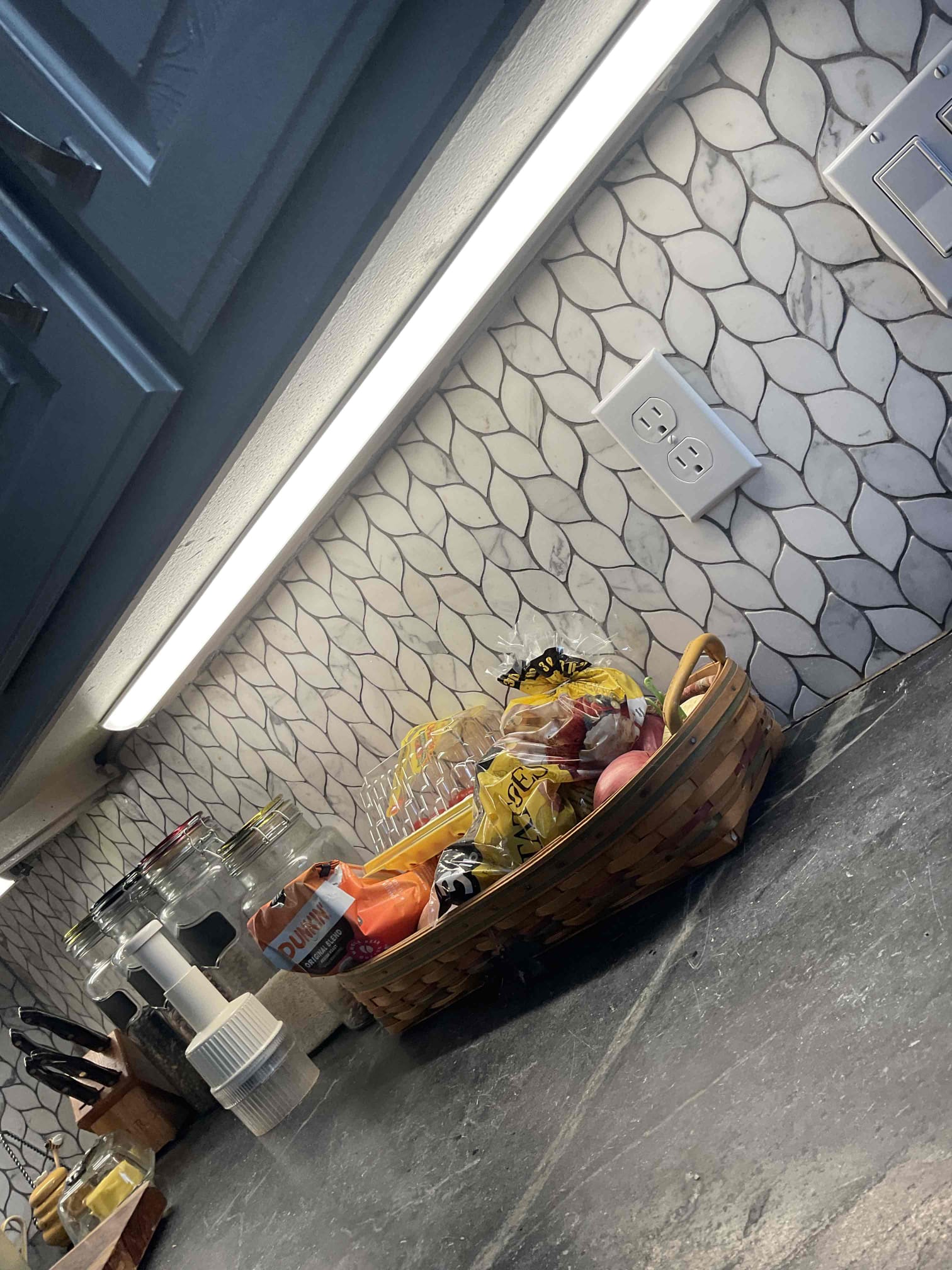 Arrived on site and the customer stated that five kitchen LED fixtures were flickering and intermittently not operating throughout the day. Performed a minor troubleshooting service by opening the switch box to inspect the switch and verify voltage, as the customer had already replaced all five fixtures with new ones.

Found a Leviton dimmer switch installed with Mode A and Mode B settings. Manufacturer instructions indicate that if LED lights flicker or dim intermittently, the switch should be changed from Mode A to Mode B for proper operation. Adjusted the switch accordingly. While on site and during completion of the home safety evaluation, the lights operated properly with no further flickering observed.

During the safety inspection, noted that the electrical panels are outdated and over 40 years old. The right-side panel main breaker was buzzing and contained double-lugged neutrals and grounds. The home also lacks a proper grounding system, and multiple code violations were obser