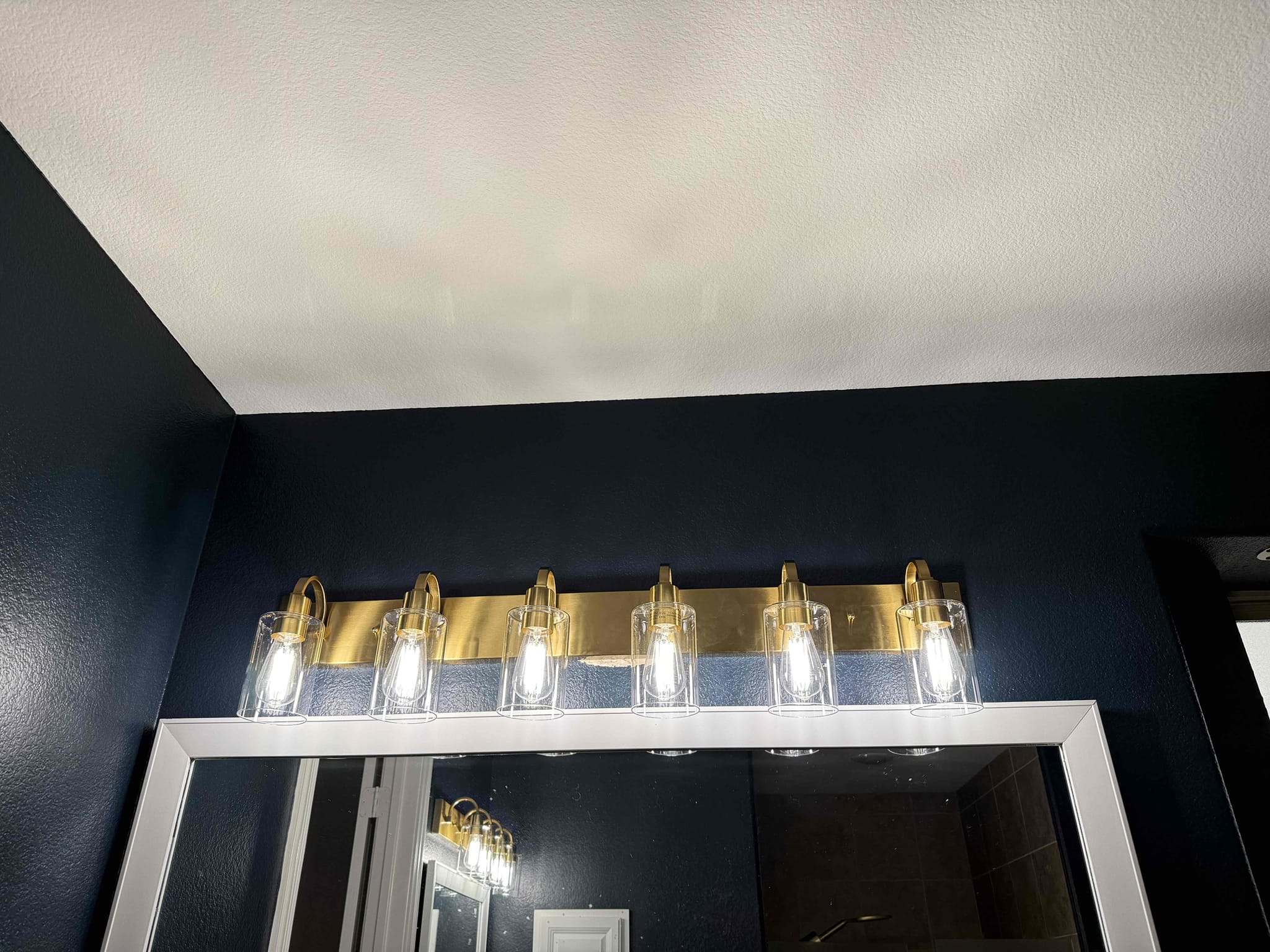 Arrived on the job site, and the customer requested replacement of both master bathroom vanity light fixtures. Both fixtures were successfully replaced. The customer received a five-year warranty covering the installation and all electrical connections. The customer was 100% happy and satisfied with today’s visit.