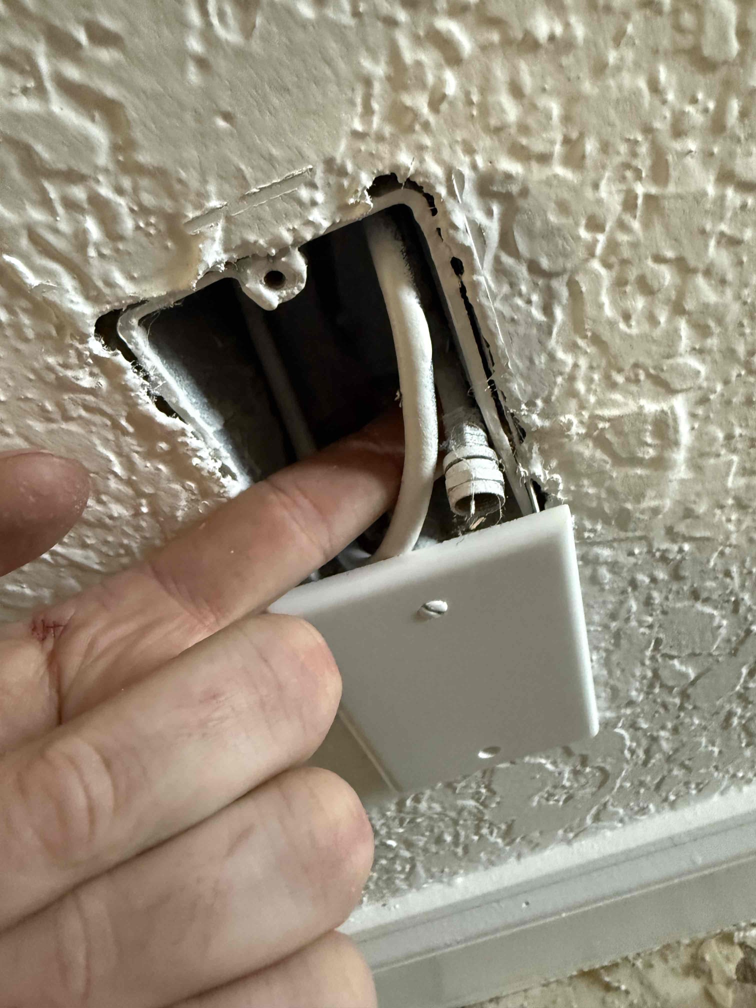 Customers are just now moving into the house and had a hole in the wall where range would typically go. I said live wire. Did not find any live wire in the hole. Left different options of getting different areas taken care of. I’m calling customer back next Wednesday around 12