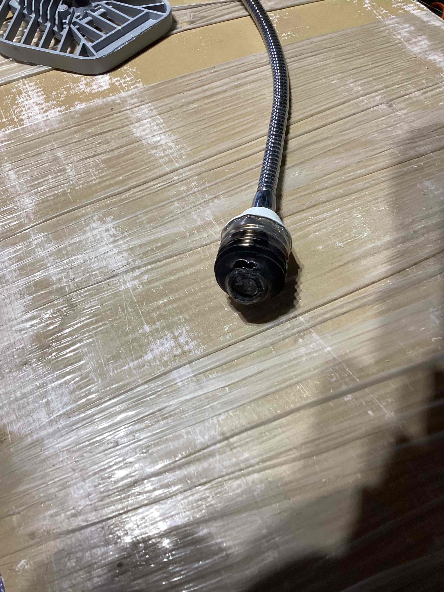 Arrived to look at issue with garage circuit not staying on. When we reset the breaker we heard the light on the garage door opener arc and when we removed the bulb found that it has direct shorted out inside the socket. Confirmed porper power is getting to the garage door opener and circuit is now holding. Garage door opener is not operational so homeowner will need to have a garage door company come and see what needs to be done to the unit.