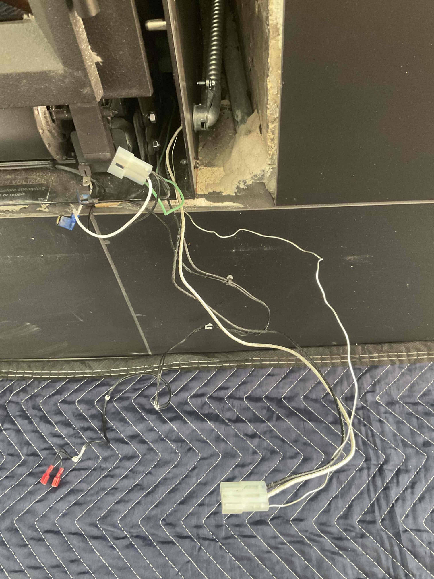 Customer called after having a breaker tripping going from the living room TV outlet to the fireplace blower shorted out. Found an inaccessible junction box mounted behind the fireplace had a short in it. Eliminated that junction box and installed a junction box where the wire came into the fireplace cut out. Ran circuit extension from new junction box to the fireplace. Checked voltage and all normal readings. Fireplace company will install connector on new wiring for replacement blower. Customer is happy with the repair 