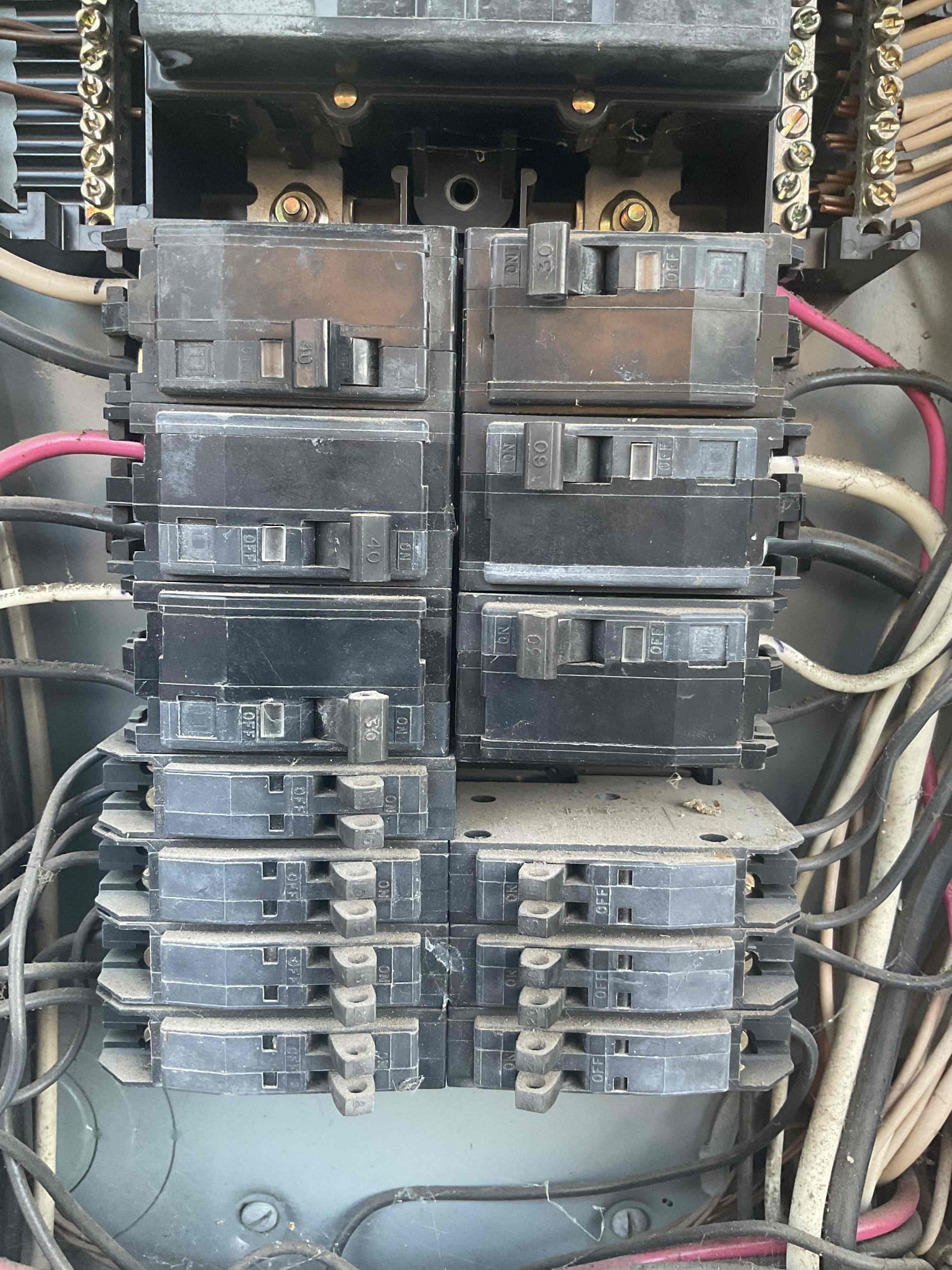Customer called about his heat pump AC condenser breaker tripping. Found breaker shows normal voltage with disconnect off. Breaker holds while disconnected from condenser. Possibly an issue with the unit. Also found main feed wire is burnt up. Informed customer that under a load, the loose connection may be the cause of the issue. Highly recommended replacing the panel due to damage as well as age. 