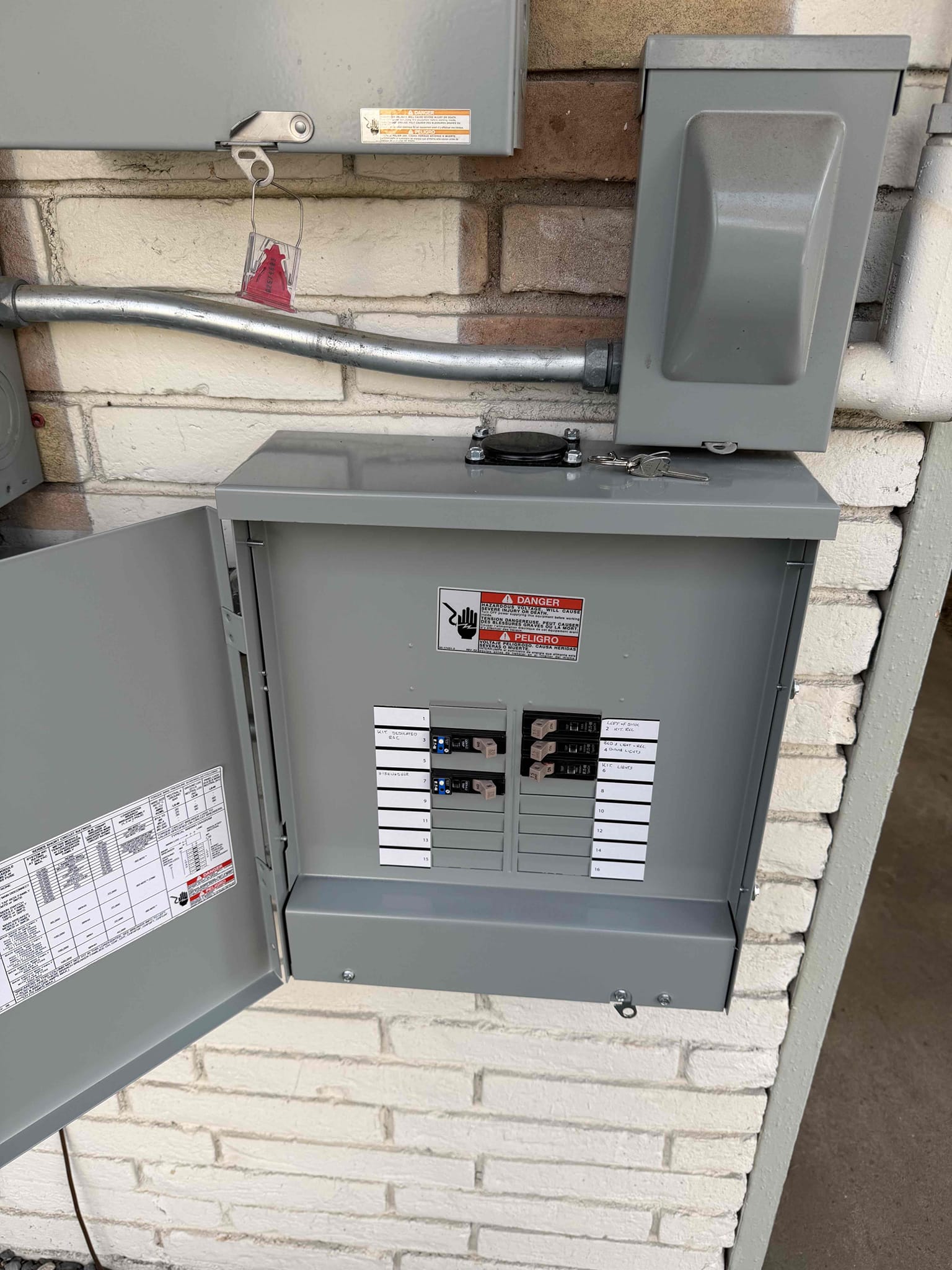 Customer had issue with breaker tripping controlling dishwasher and found that there were multiple countertop plugs on the same circuit. Explained it needs to be dedicated and that it will be very difficult running wire in the attic. Also started talking about refereeing power out to detached garage and fixing the wires out there. Customer needs to talk with husband about which option to go with.

Ran dedicated 100 amp circuit from main panel through attic to outside and ran conduit down outside under deck and into covered parking and ran cable to sub panel in detached building.  Replaced sub panel in building and installed ground rod and whole home surge protection.  Ran dedicated circuit to dishwasher, and kitchen outlet immediately left of the sink.  Ran Ethernet cable from router to office and hooked directly into computer.  Demoed Romex under building by pool and piped in and ran all new wiring and installed outlet on back deck. 