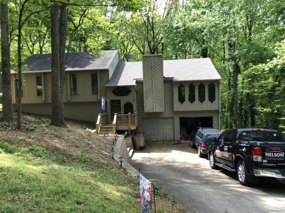 New HardiePlank siding, MI vinyl windows with bronze laminate, Sherwin-Williams paint job, and a new GAF roof New HardiePlank siding, MI vinyl windows with bronze laminate, Sherwin-Williams paint job, and a new GAF roof