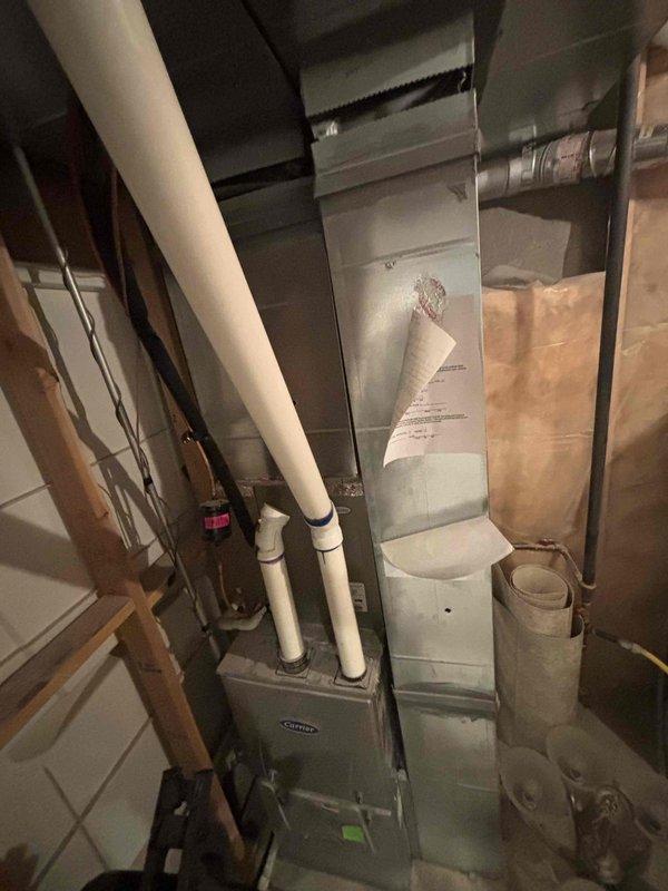 Diagnosed 9-year-old HVAC system with complete compressor capacitor failure and weak fan capacitor. Upon replacement of capacitor, discovered refrigerant leak at heavily rusted indoor coil preventing system operation. Compressor and fan motor running amps within acceptable range, but starting amps exceed manufacturer specifications. Additionally noted furnace heat exchanger displaying overheating marks and rust along seams; while unit remains suitable for AC operation, furnace maintenance recommended to ensure safe heating function. System requires indoor coil replacement; will verify warranty coverage and part availability before proceeding with repairs.