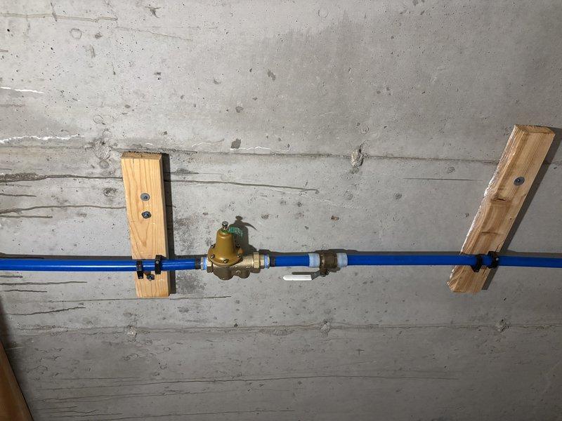 Responded to complaint of excessive leaking from temperature and pressure relief valve discharge pipe on 2019 tank-style water heater. Upon inspection, identified failed TPR valve with continuous dripping beyond normal thermal expansion discharge. Replaced defective TPR valve with properly rated 150 PSI unit and confirmed secure installation with appropriate thread sealant. Verified expansion tank functionality and proper system pressurization at brass pressure regulator mounted on cold water supply line. Tested all connections for leaks and confirmed TPR valve discharge pipe properly terminates with no active dripping after replacement.