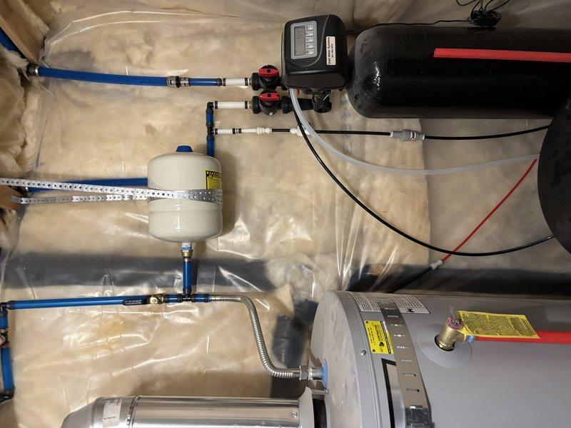 Responded to complaint of excessive leaking from temperature and pressure relief valve discharge pipe on 2019 tank-style water heater. Upon inspection, identified failed TPR valve with continuous dripping beyond normal thermal expansion discharge. Replaced defective TPR valve with properly rated 150 PSI unit and confirmed secure installation with appropriate thread sealant. Verified expansion tank functionality and proper system pressurization at brass pressure regulator mounted on cold water supply line. Tested all connections for leaks and confirmed TPR valve discharge pipe properly terminates with no active dripping after replacement.