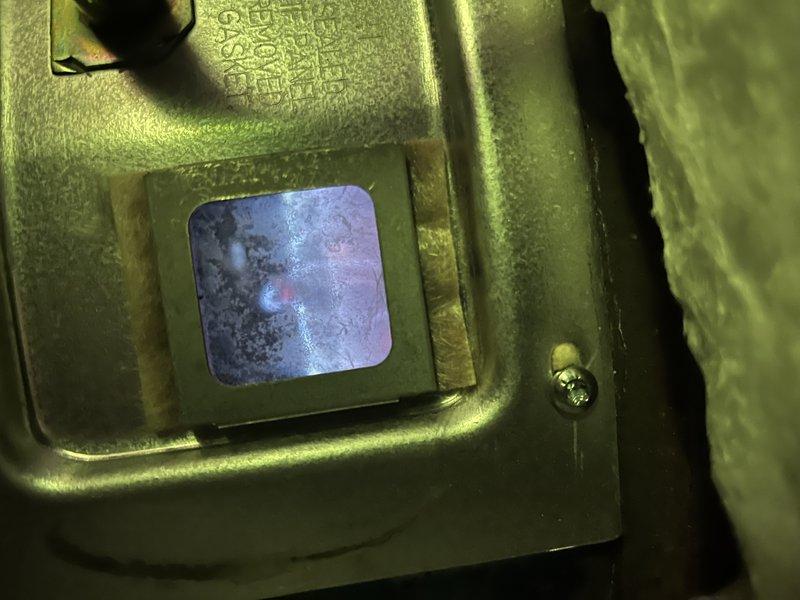Responded to service call for two 50-gallon tank water heaters in basement, with one unit failing to ignite despite pilot light remaining lit after relighting. Performed diagnostic testing and pressure measurements on malfunctioning unit, recording system pressure at approximately 250 psi using calibration gauge. Inspected gas control valve assembly and sight glass window for proper operation and flame verification. Completed maintenance flush service on both 10-year-old water heater tanks to remove sediment buildup and restore optimal heating efficiency.