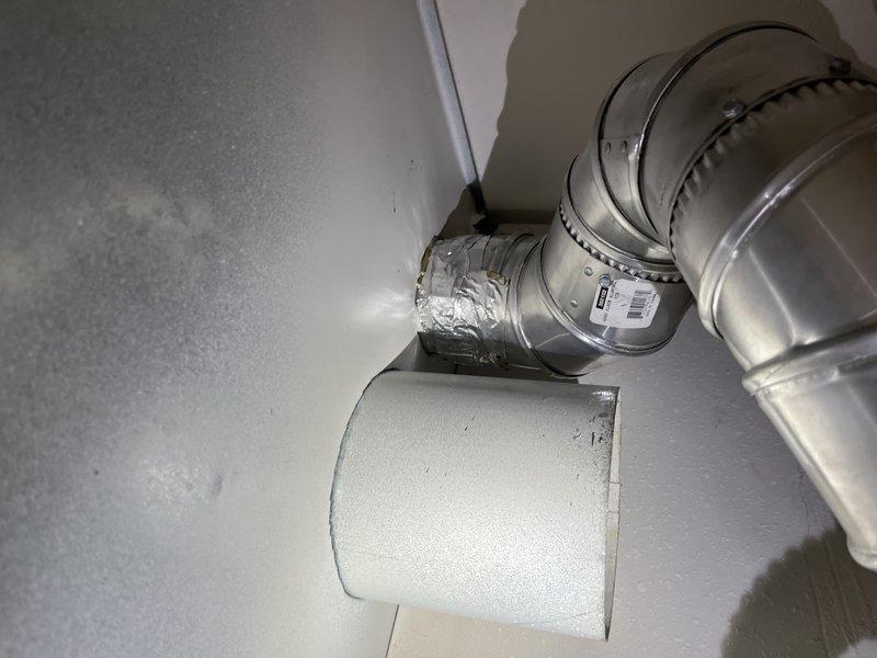 Responded to a no hot water complaint on an approximately one-year-old tank-type water heater. Upon arrival, performed diagnostic evaluation of the unit and associated components, including inspection of the water heater controls, heating elements, and gas/electric supply connections. Documented existing conditions with photographic evidence showing the water heater installation in utility closet with visible service markings and connected plumbing fixtures. Unit was assessed for proper operation and potential causes of hot water failure, including thermostat function, pilot light or ignition system status, and supply line integrity.